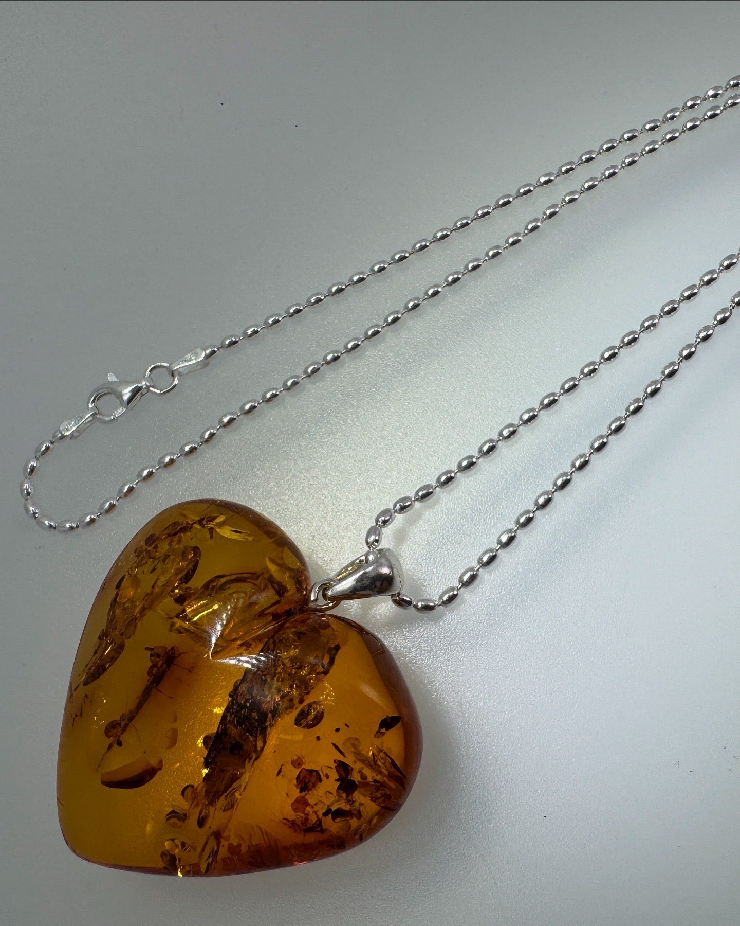 Oversized Hand-Carved Baltic Amber Puffy Heart Pendant – Cognac Honey with Sterling Silver Bead Chain