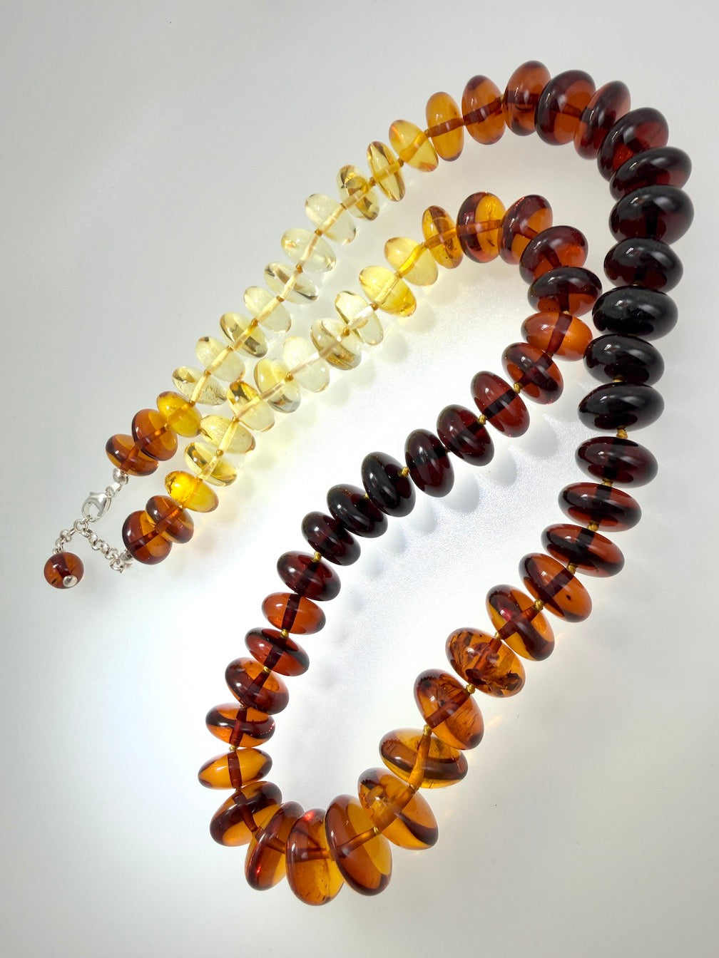 Museum Quality Rainbow Multicolor Ombré Baltic Amber Donut Bead Necklace – 22 Inch Graduated Strand