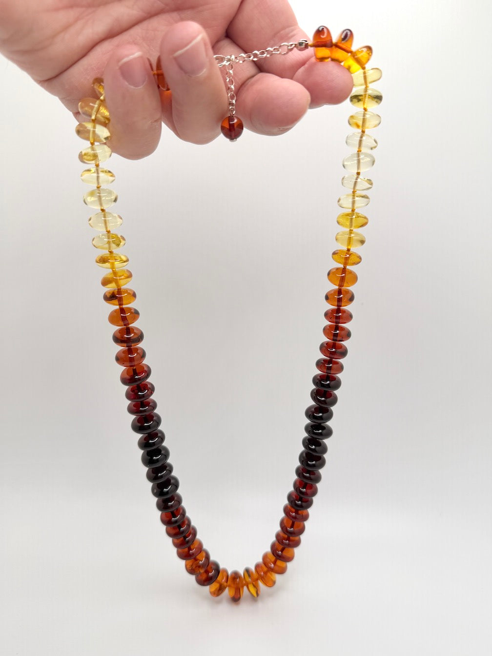 Museum Quality Rainbow Multicolor Ombré Baltic Amber Donut Bead Necklace – 22 Inch Graduated Strand