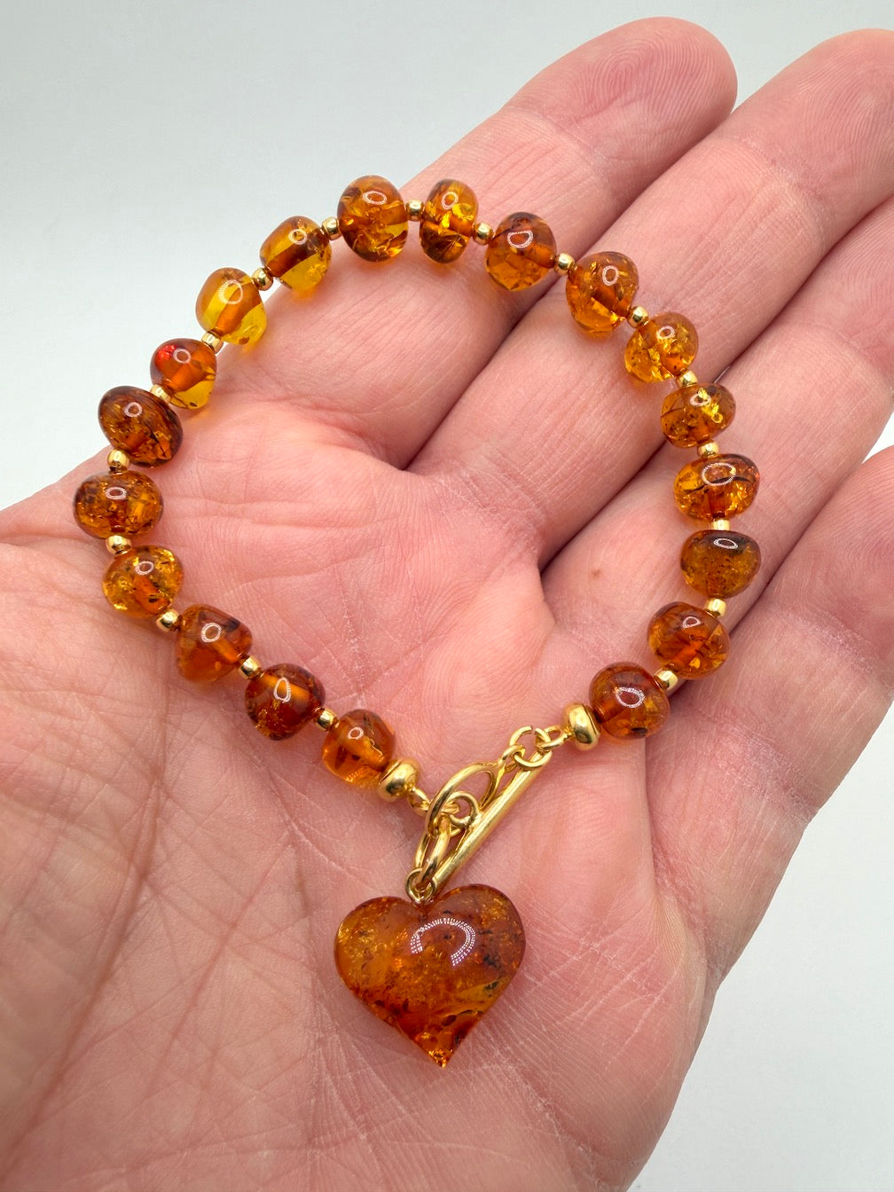 Handmade Honey Baltic Amber Bead Bracelet with Heart Charm – Genuine Baltic Amber & Gold Plated Sterling Silver Toggle
