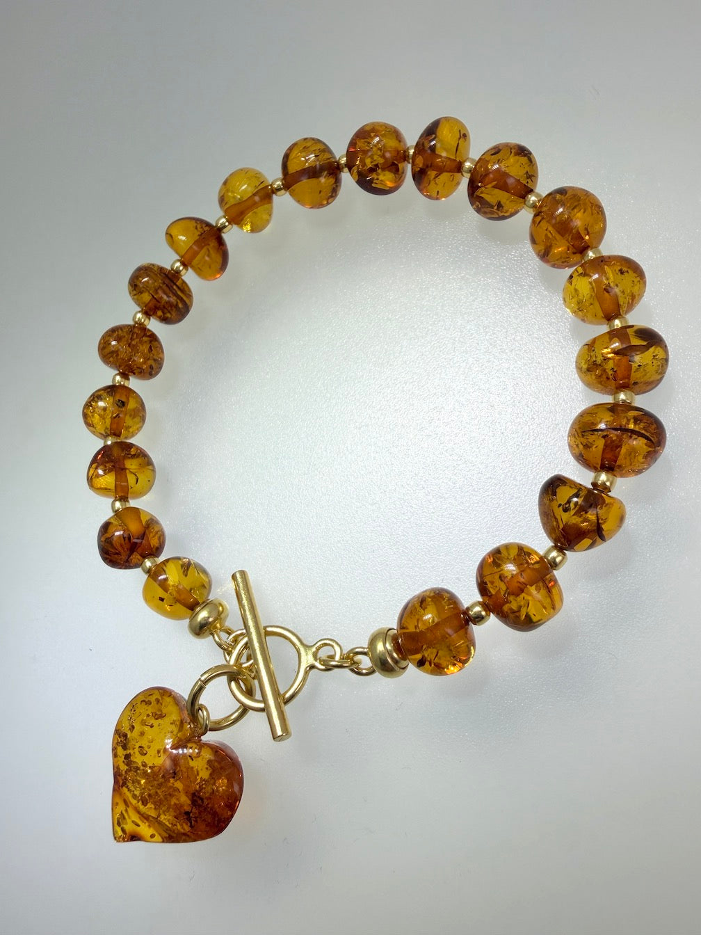 Handmade Honey Baltic Amber Bead Bracelet with Heart Charm – Genuine Baltic Amber & Gold Plated Sterling Silver Toggle