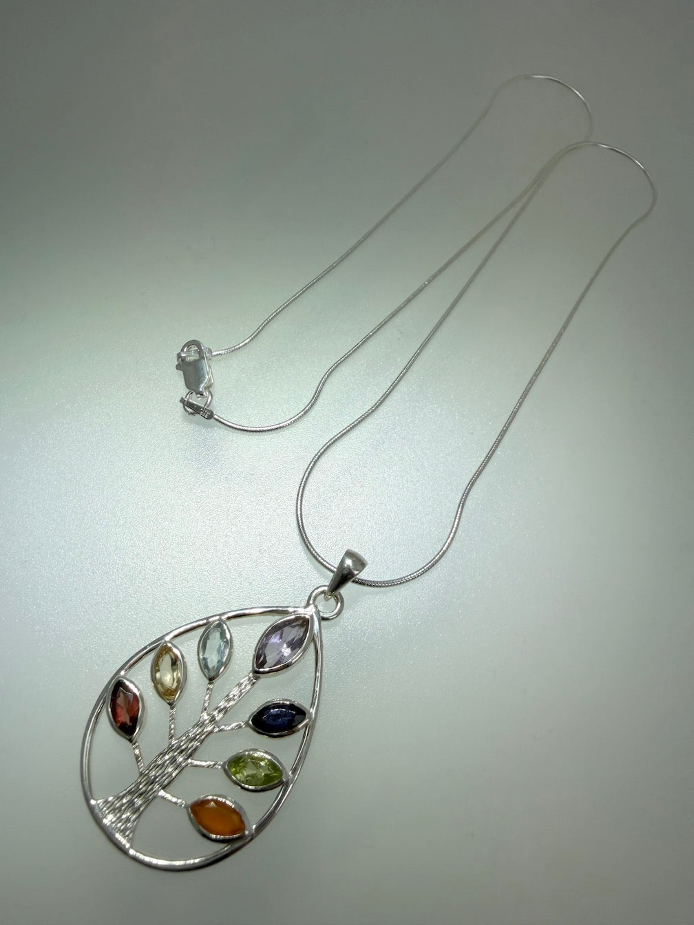 Handmade Multi-Stone Tree of Life Pendant – Sterling Silver Teardrop Necklace with Amethyst, Blue Topaz, Peridot, Aquamarine & Quartz – Nature Inspired Statement Jewelry