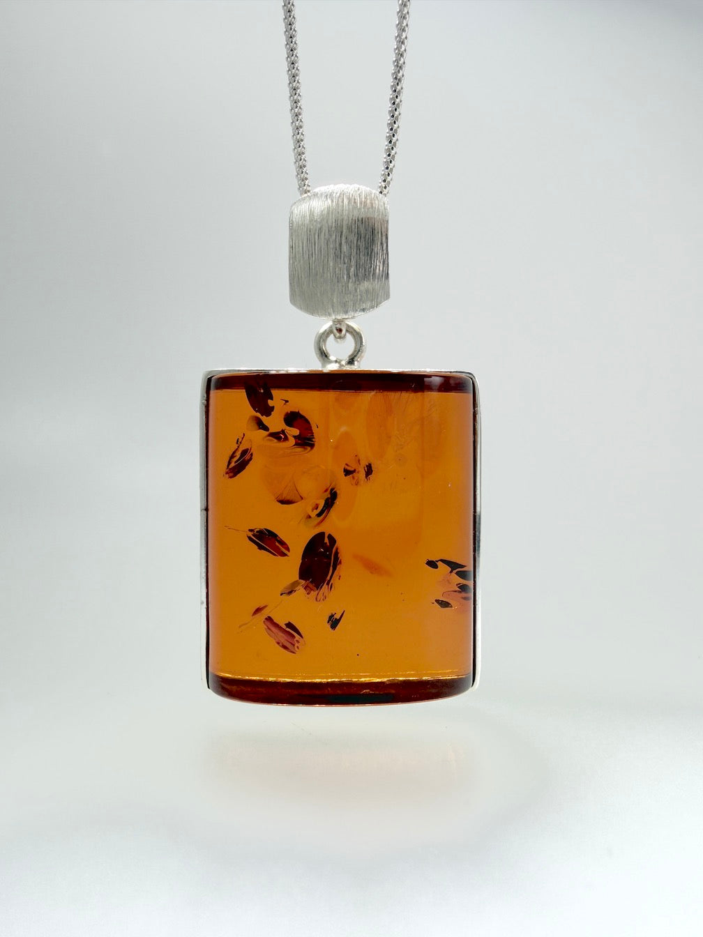 Handmade in Poland Modern Contemporary Sterling Silver Rectangular Brushed Pendant with Genuine Cognac Baltic Amber