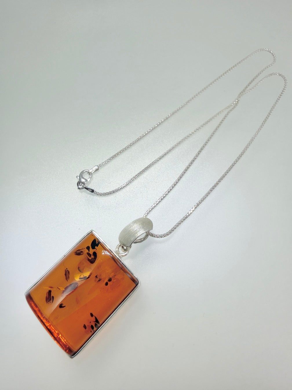 Handmade in Poland Modern Contemporary Sterling Silver Rectangular Brushed Pendant with Genuine Cognac Baltic Amber