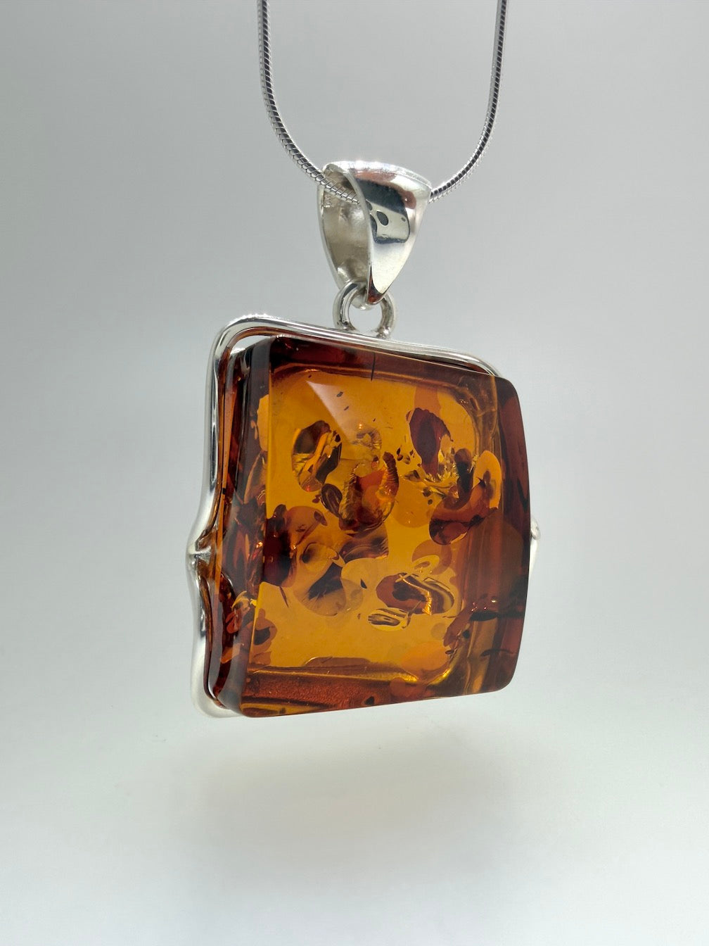 Handmade in Poland Modern Contemporary Sterling Silver Rectangular Pendant with Genuine Cognac Baltic Amber