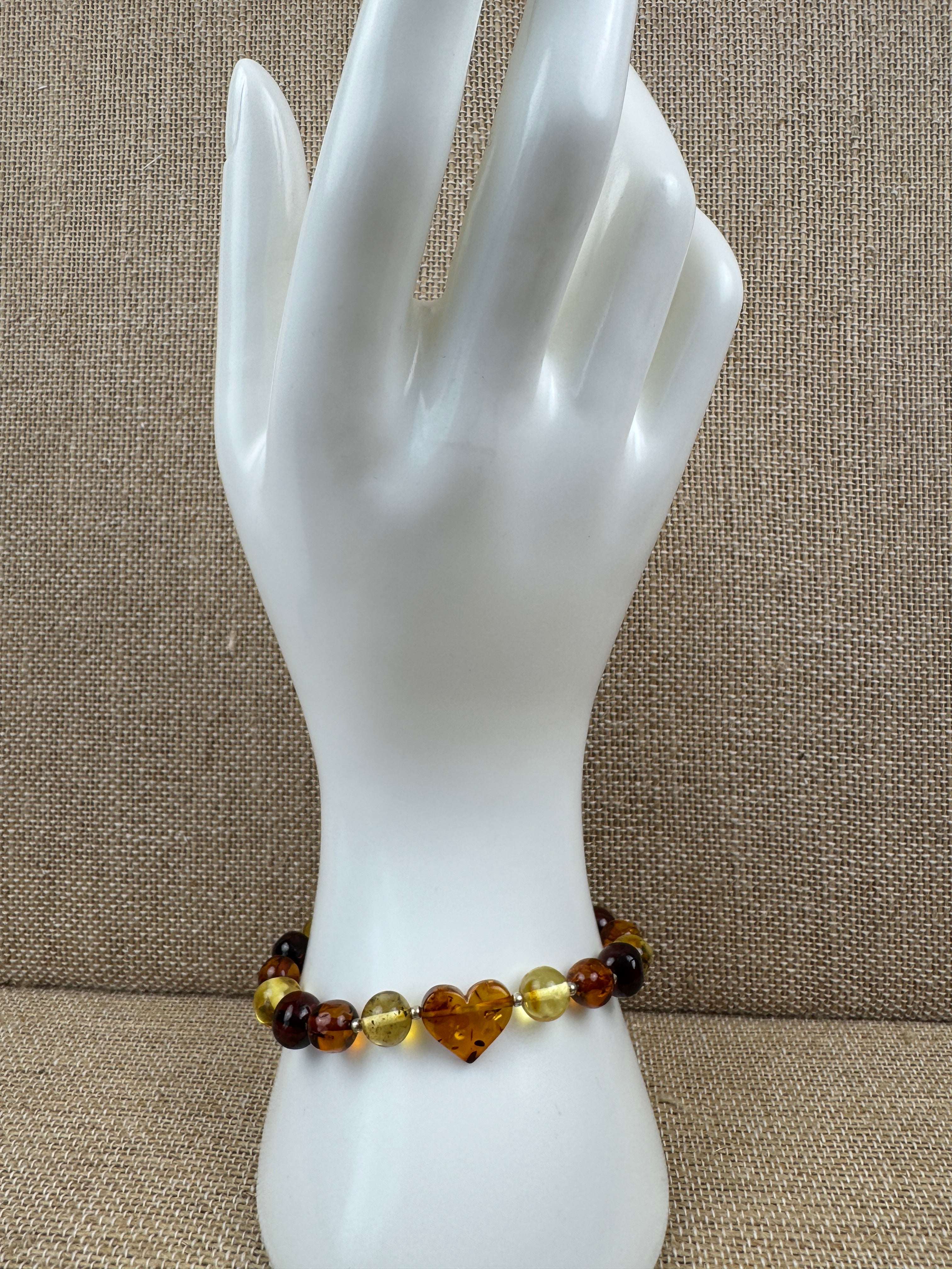 Multicolor Baltic Amber Stretch Bracelet with Hand-Carved Heart Charm – One Size Comfort Fit