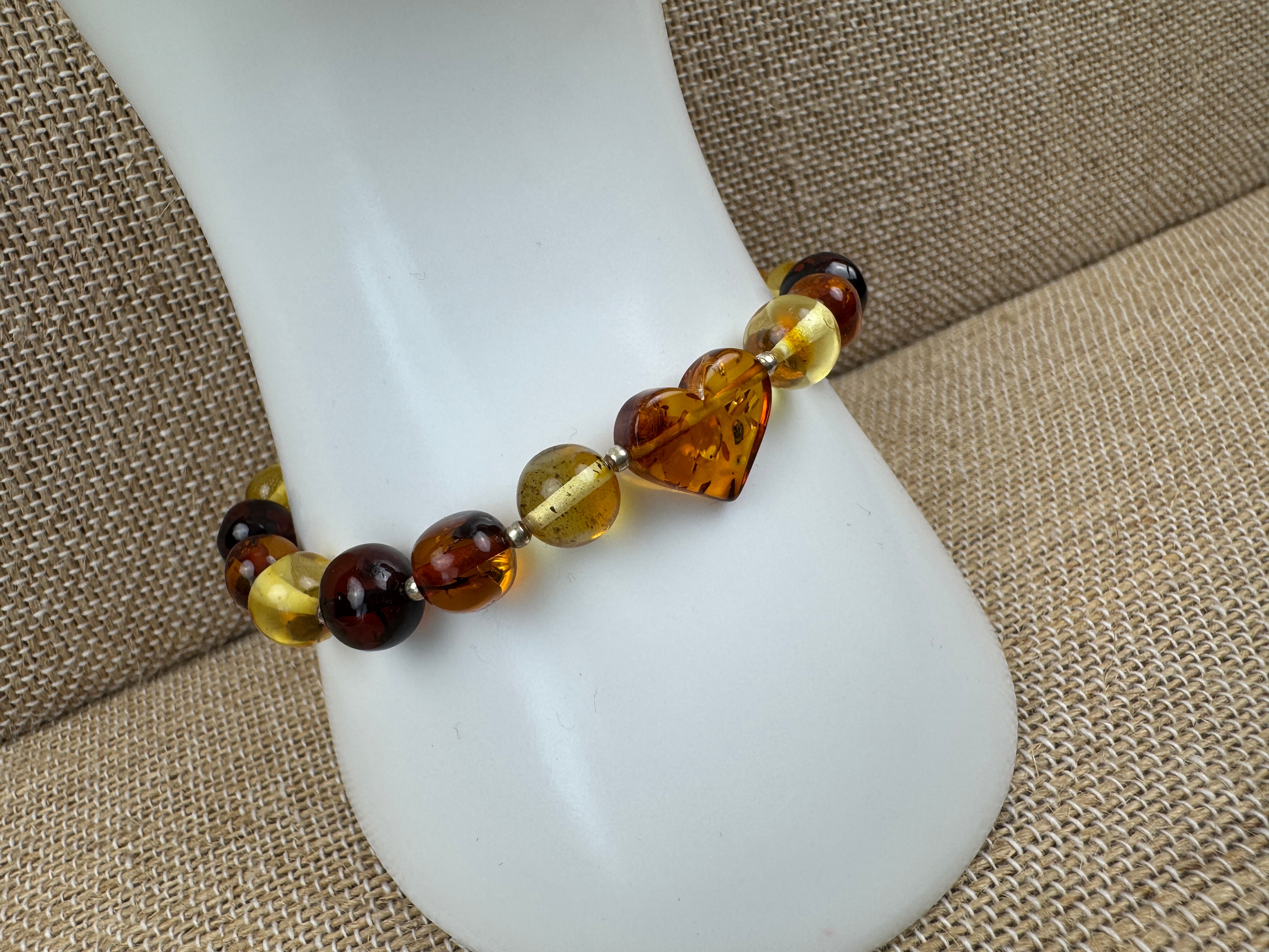 Multicolor Baltic Amber Stretch Bracelet with Hand-Carved Heart Charm – One Size Comfort Fit