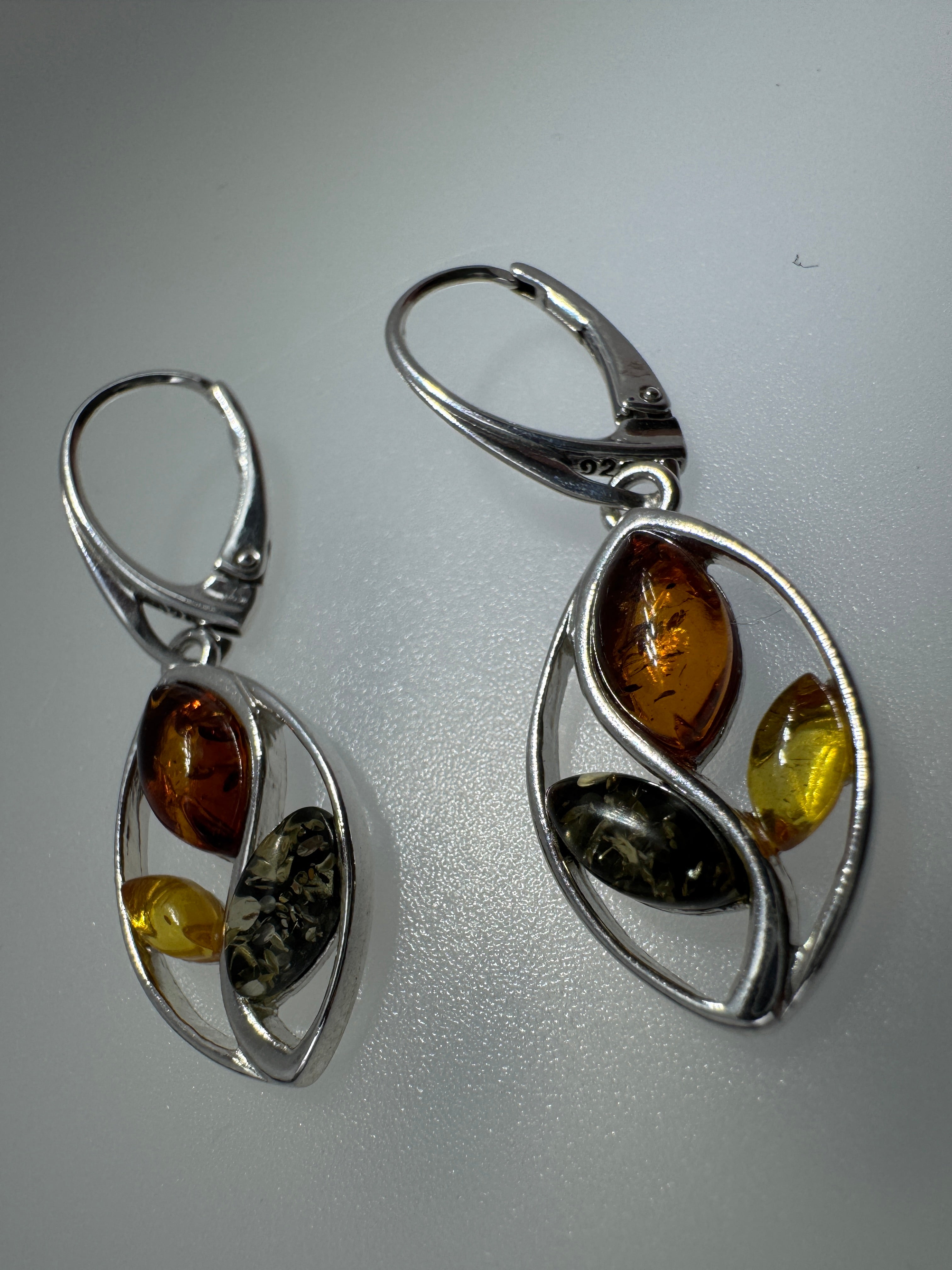 Swirl into Style: Multi-Color Baltic Amber Dangle Earrings in Sterling Silver