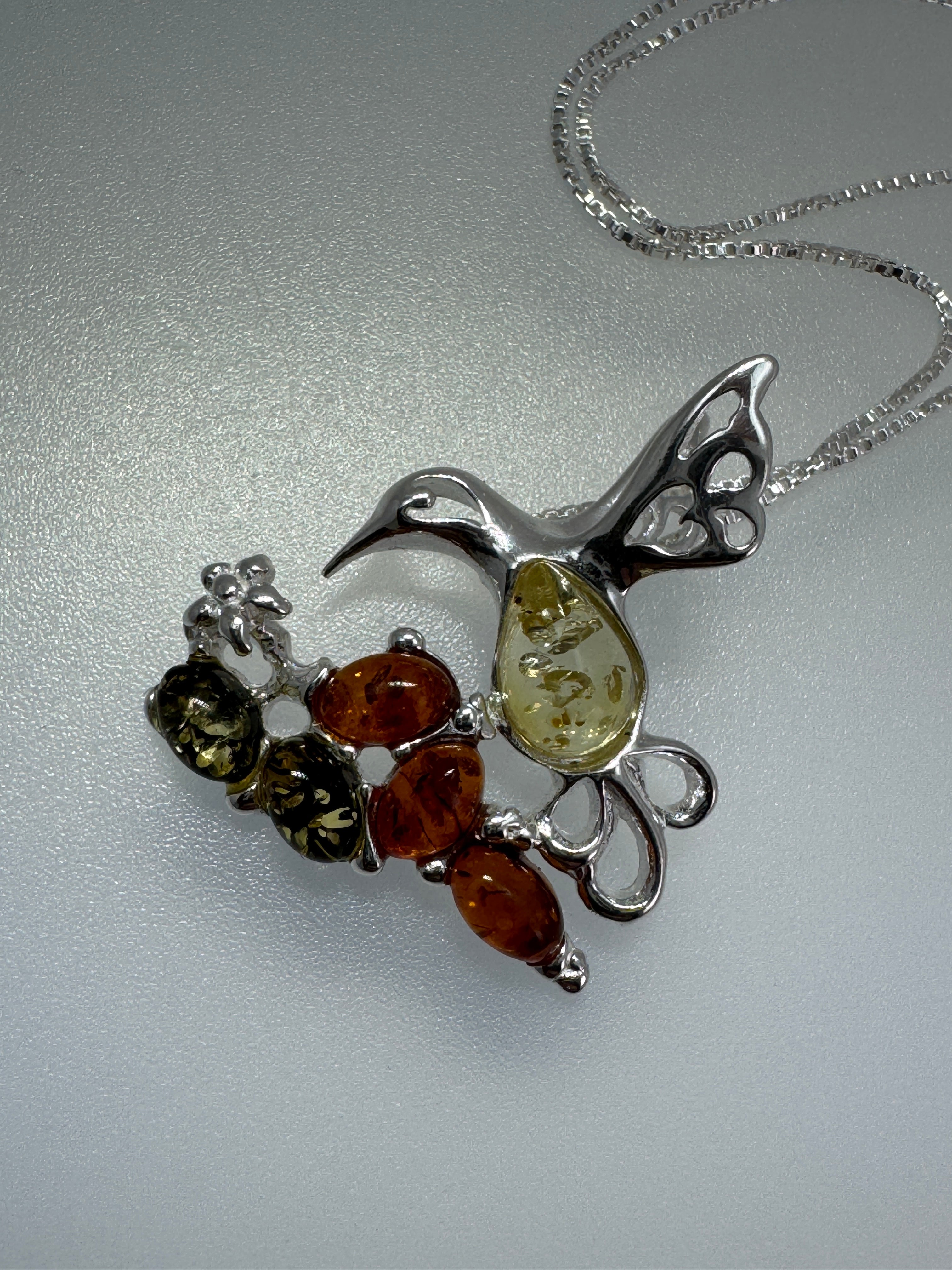 Multicolor Baltic Amber Hummingbird Pendant – Sterling Silver Elegance