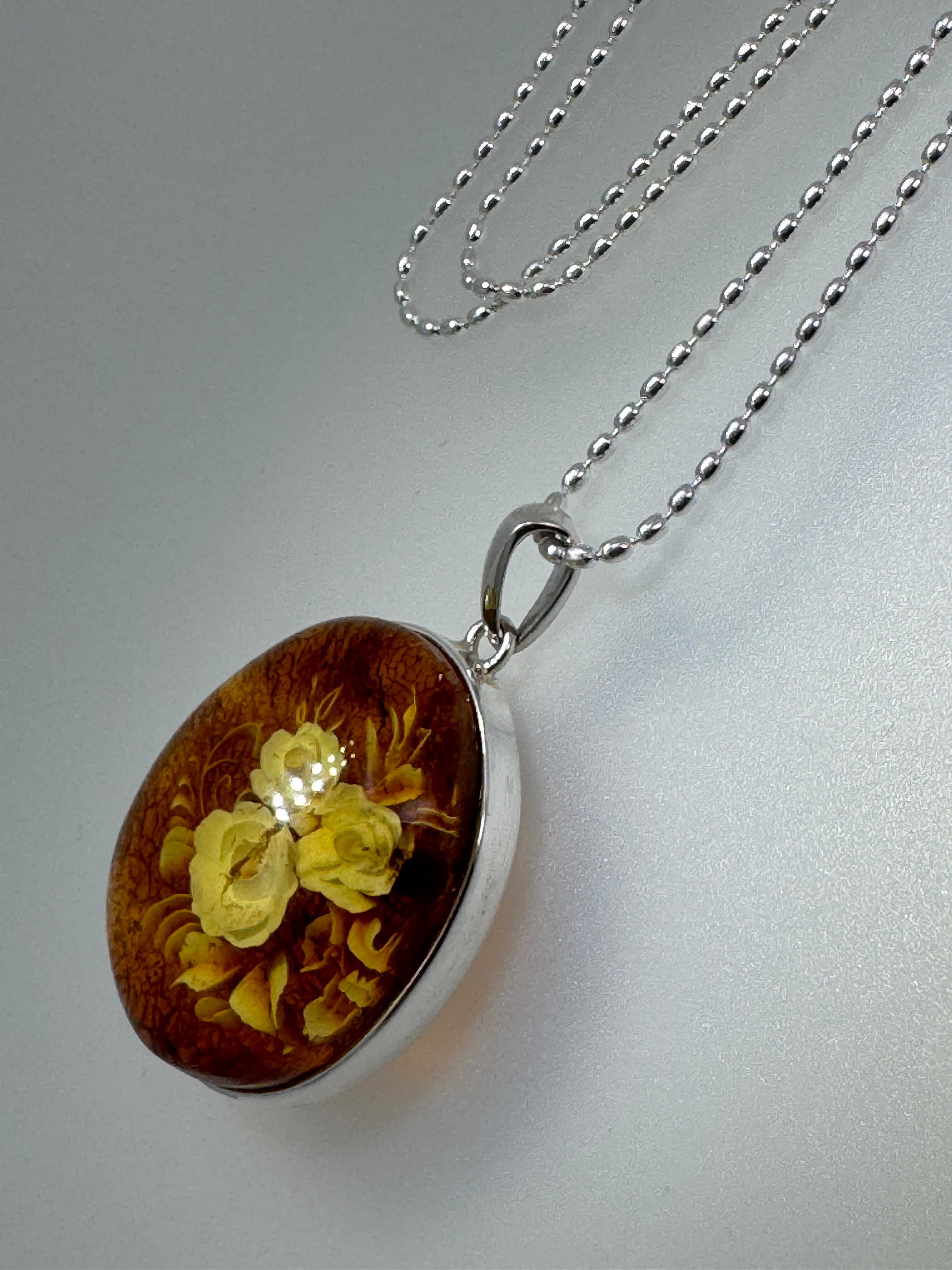 Timeless Elegance: Hand-Carved Baltic Amber Intaglio Flower Pendant