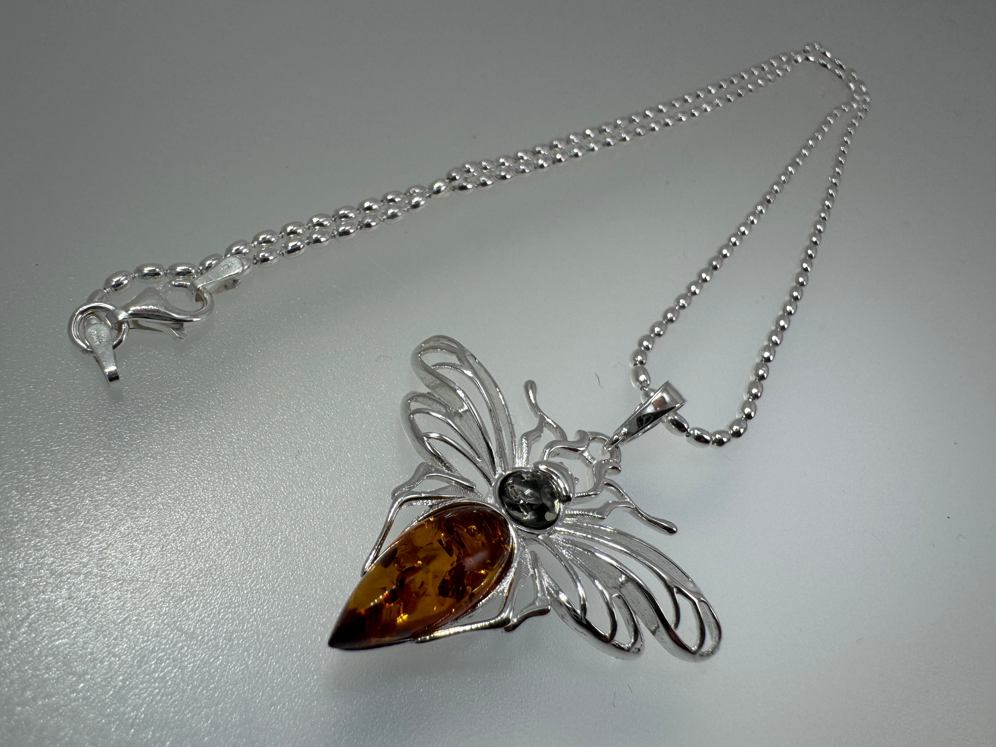 Mystic wings in amber – Sterling silver moth pendant with sterling silver chain
