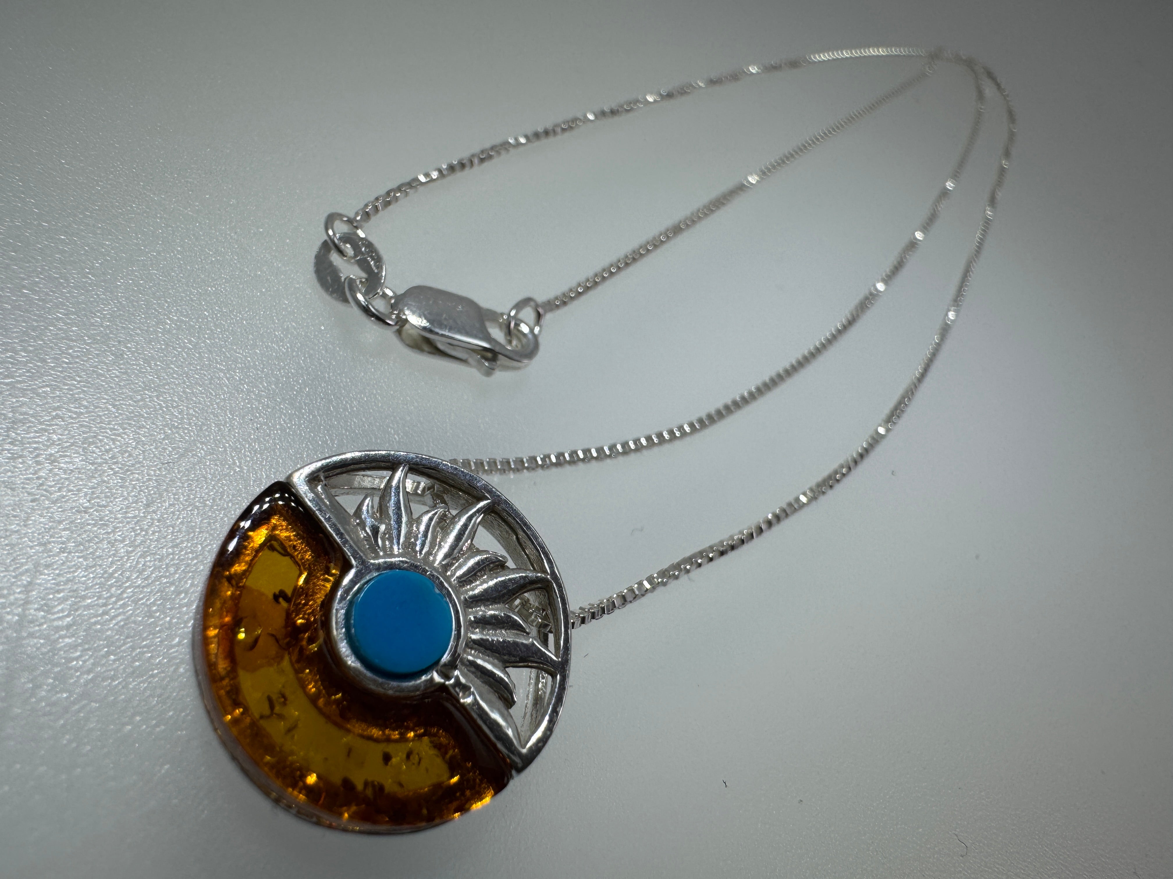Baltic amber and turquoise pendant on silver chain - A timeless fusion of cultures and nature