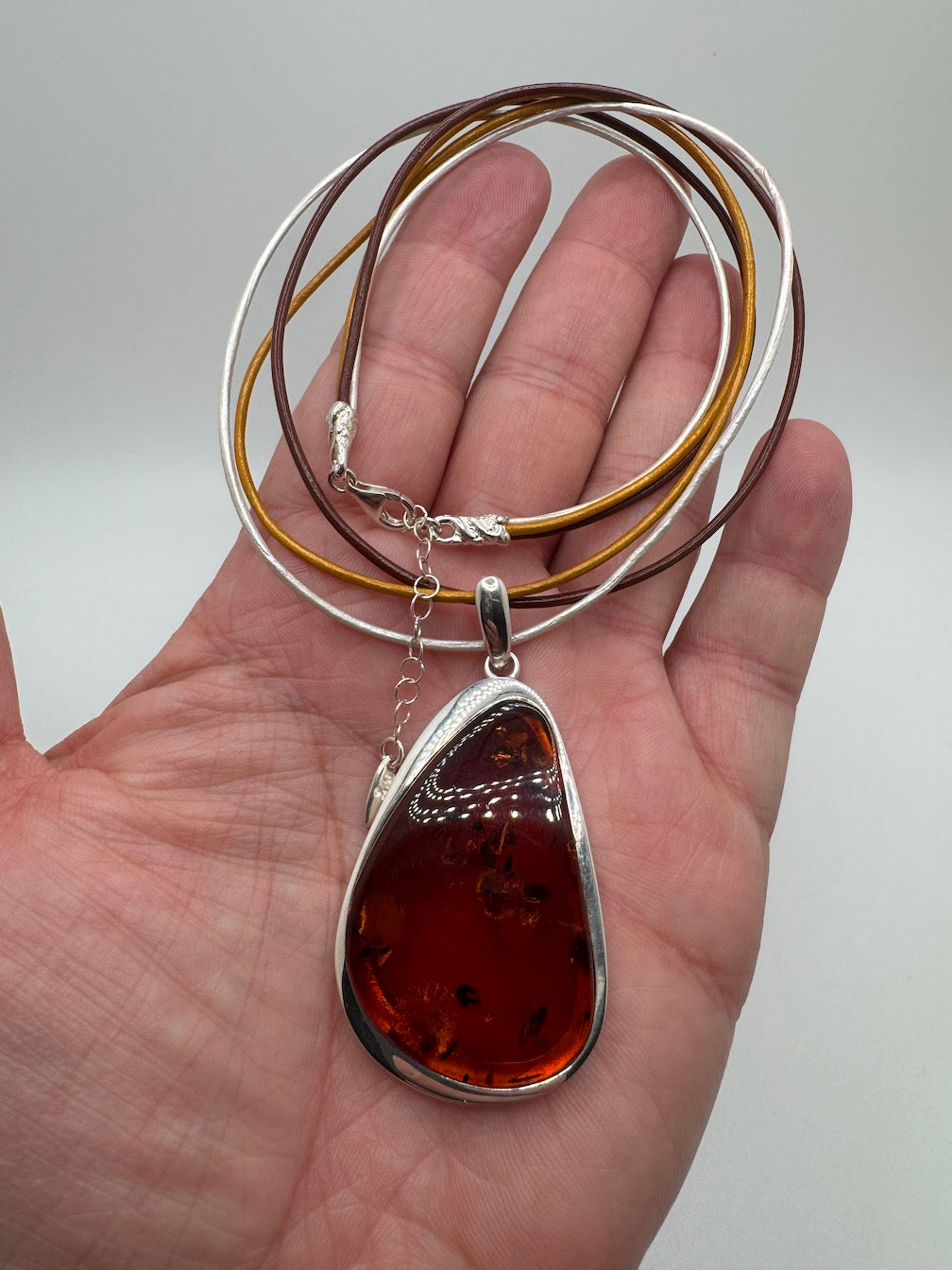 Modern Sterling Silver & Cognac Baltic Amber Pendant Necklace on Multicolor Leather Cord – Handmade in Poland