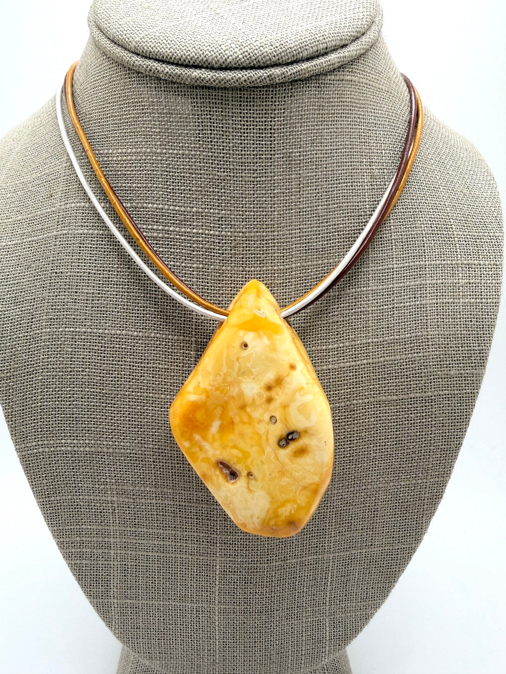One of a kind Butterscotch Amber necklace on multi leather with silver clasp
