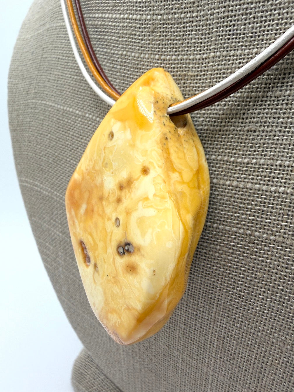 One of a kind Butterscotch Amber necklace on multi leather with silver clasp