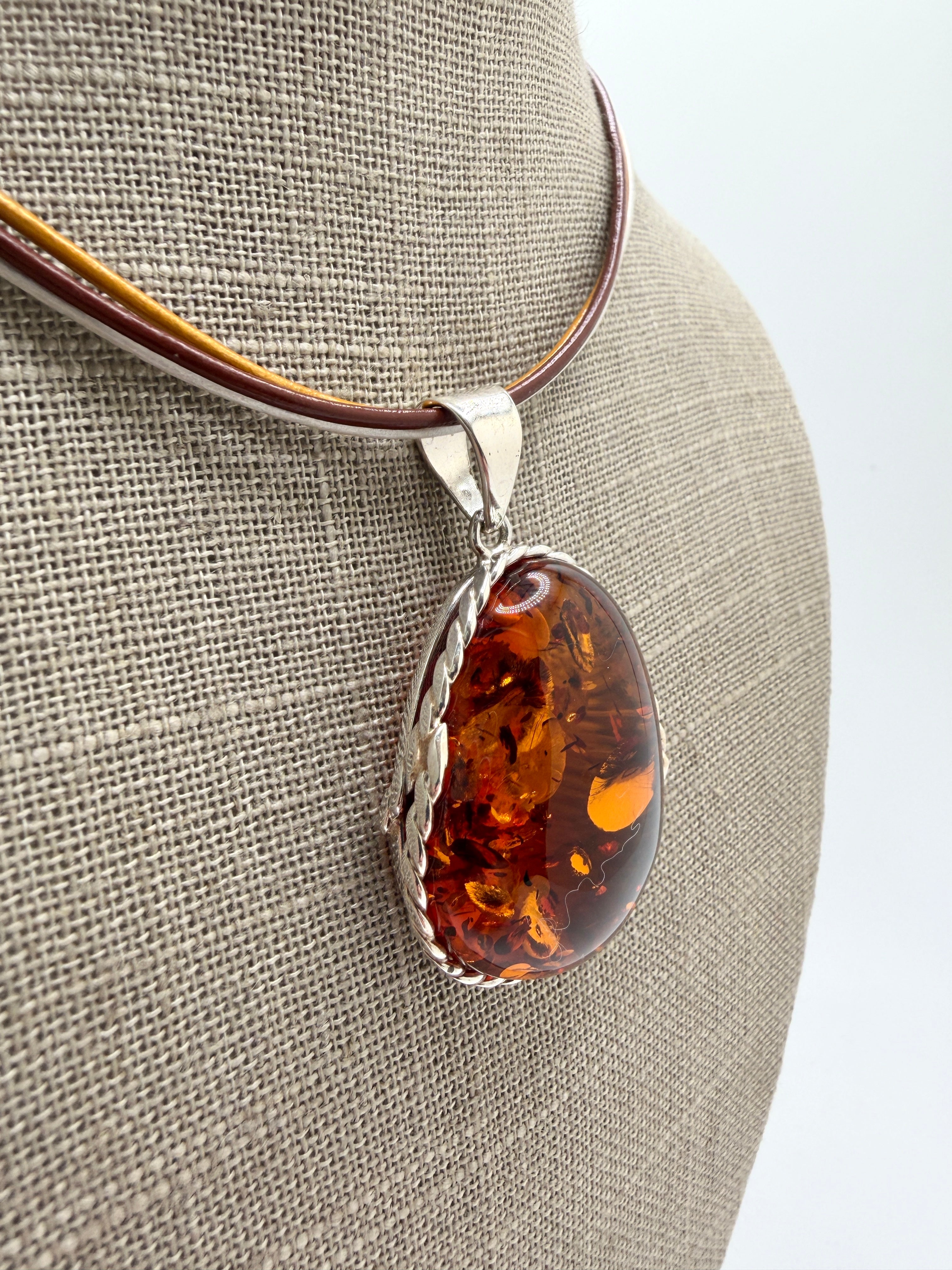 Oversized Honey Cognac Baltic Amber Pendant on Thick Brown, Gold and White Leather Cord – Handmade in Poland – Sterling Silver Setting