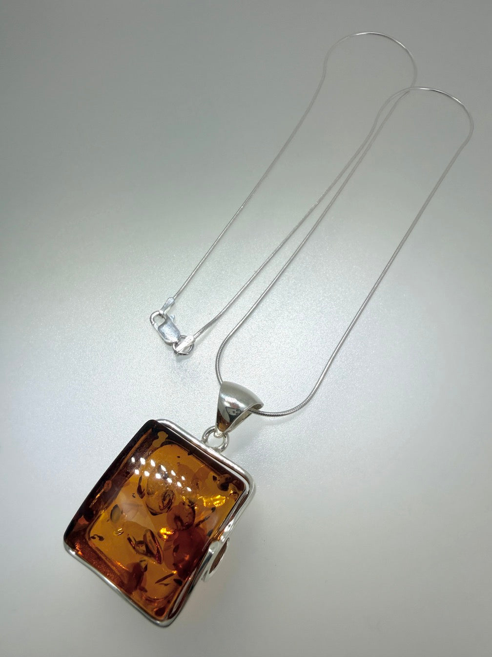Handmade in Poland Modern Contemporary Sterling Silver Rectangular Pendant with Genuine Cognac Baltic Amber