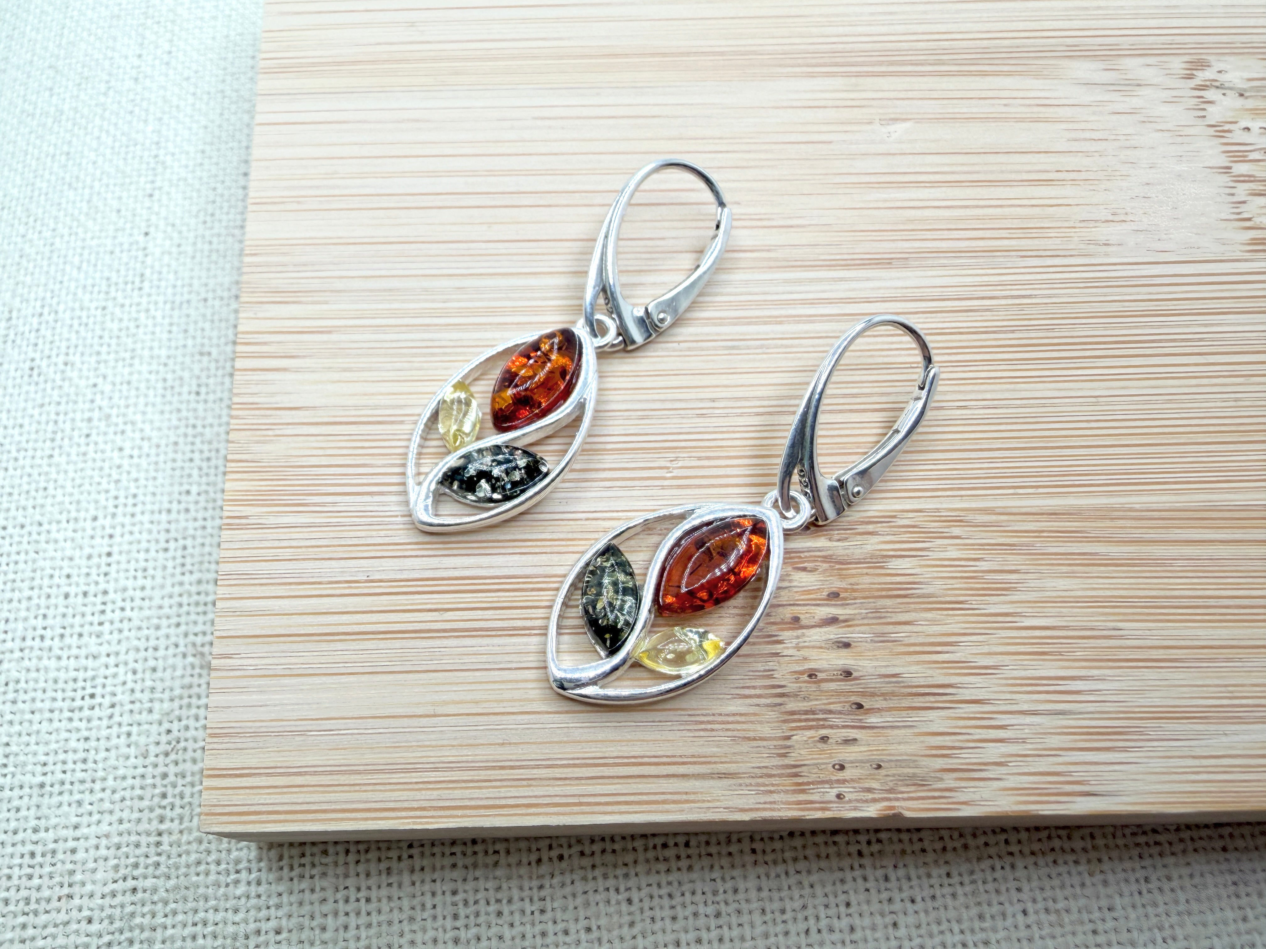 Swirl into Style: Multi-Color Baltic Amber Dangle Earrings in Sterling Silver