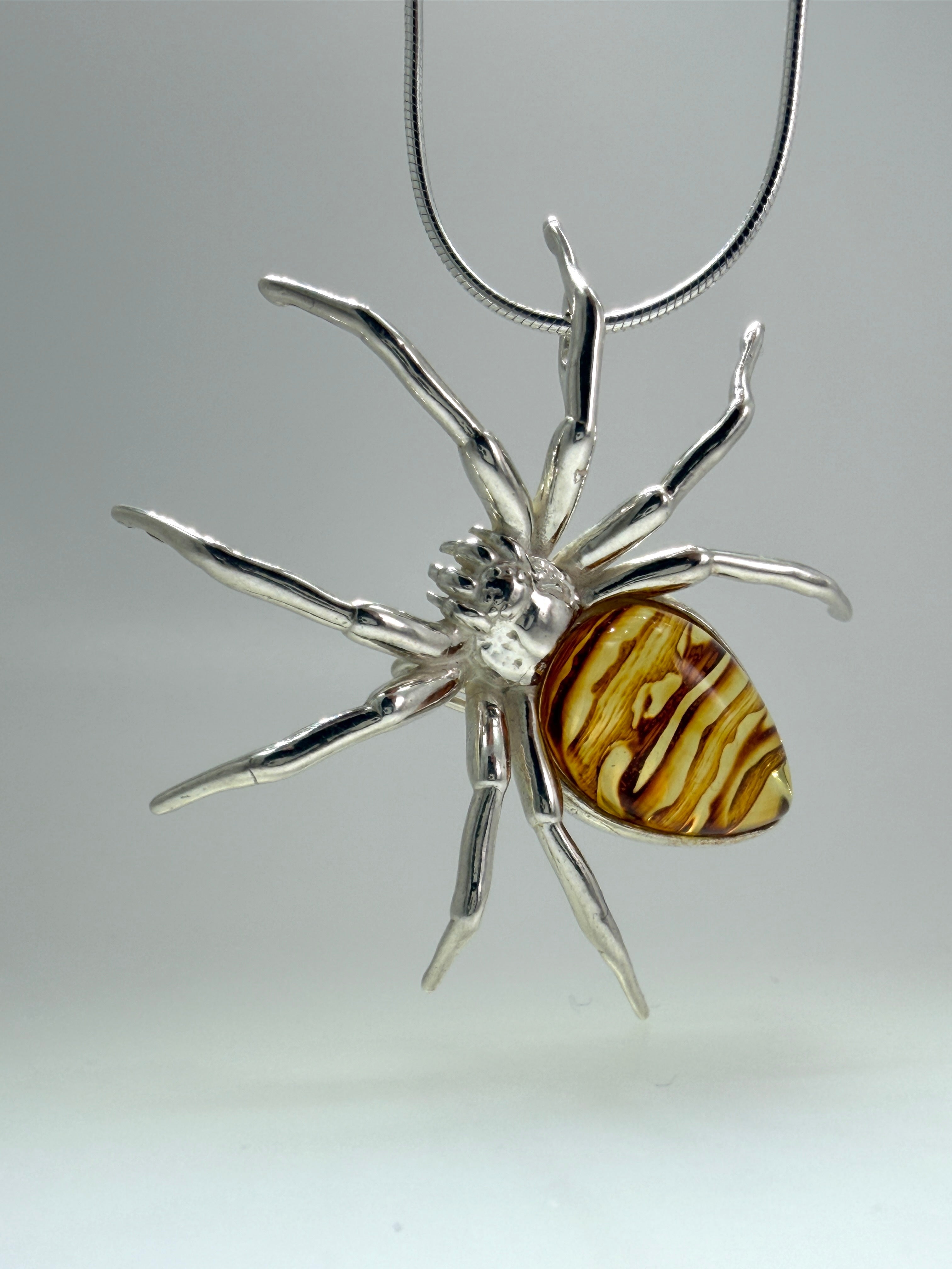 "Golden Glow Crawler" – Sterling Silver & Honey Baltic Amber Spider Pendant