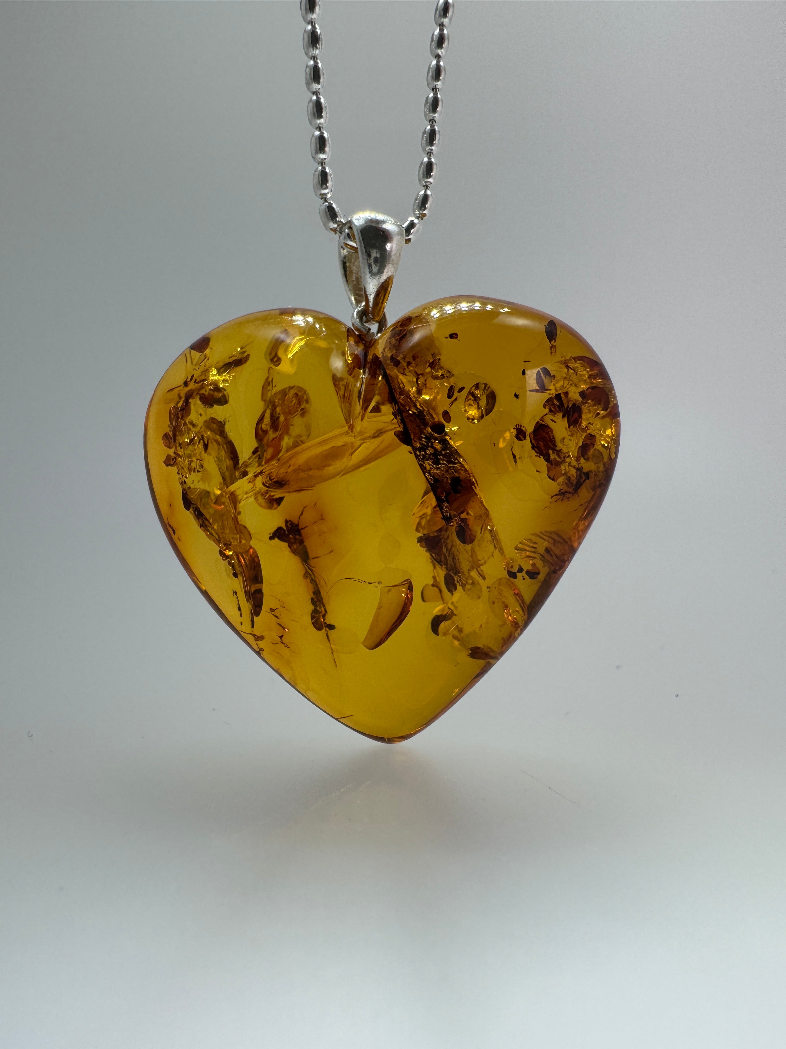Oversized Hand-Carved Baltic Amber Puffy Heart Pendant – Cognac Honey with Sterling Silver Bead Chain