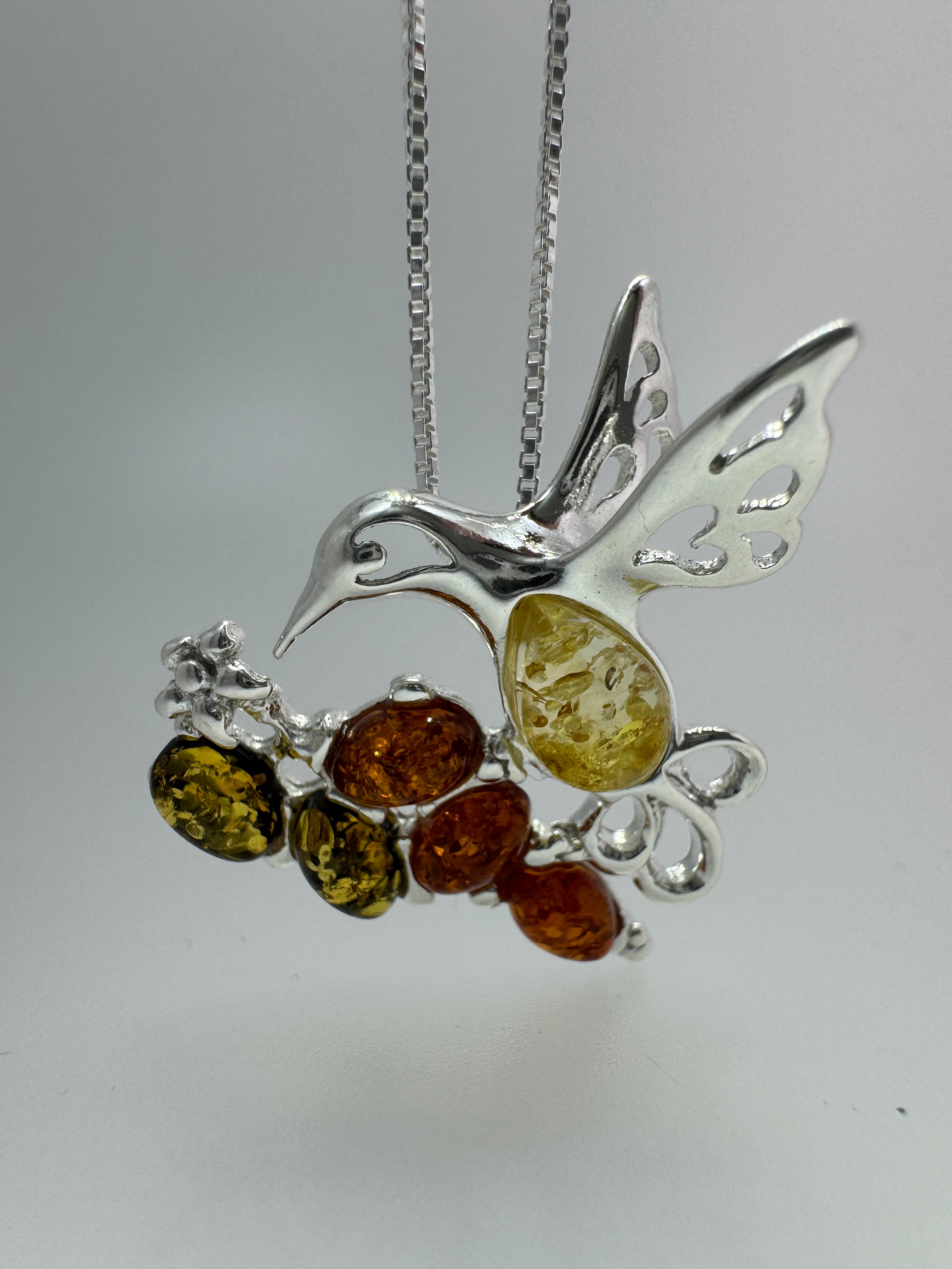 Multicolor Baltic Amber Hummingbird Pendant – Sterling Silver Elegance