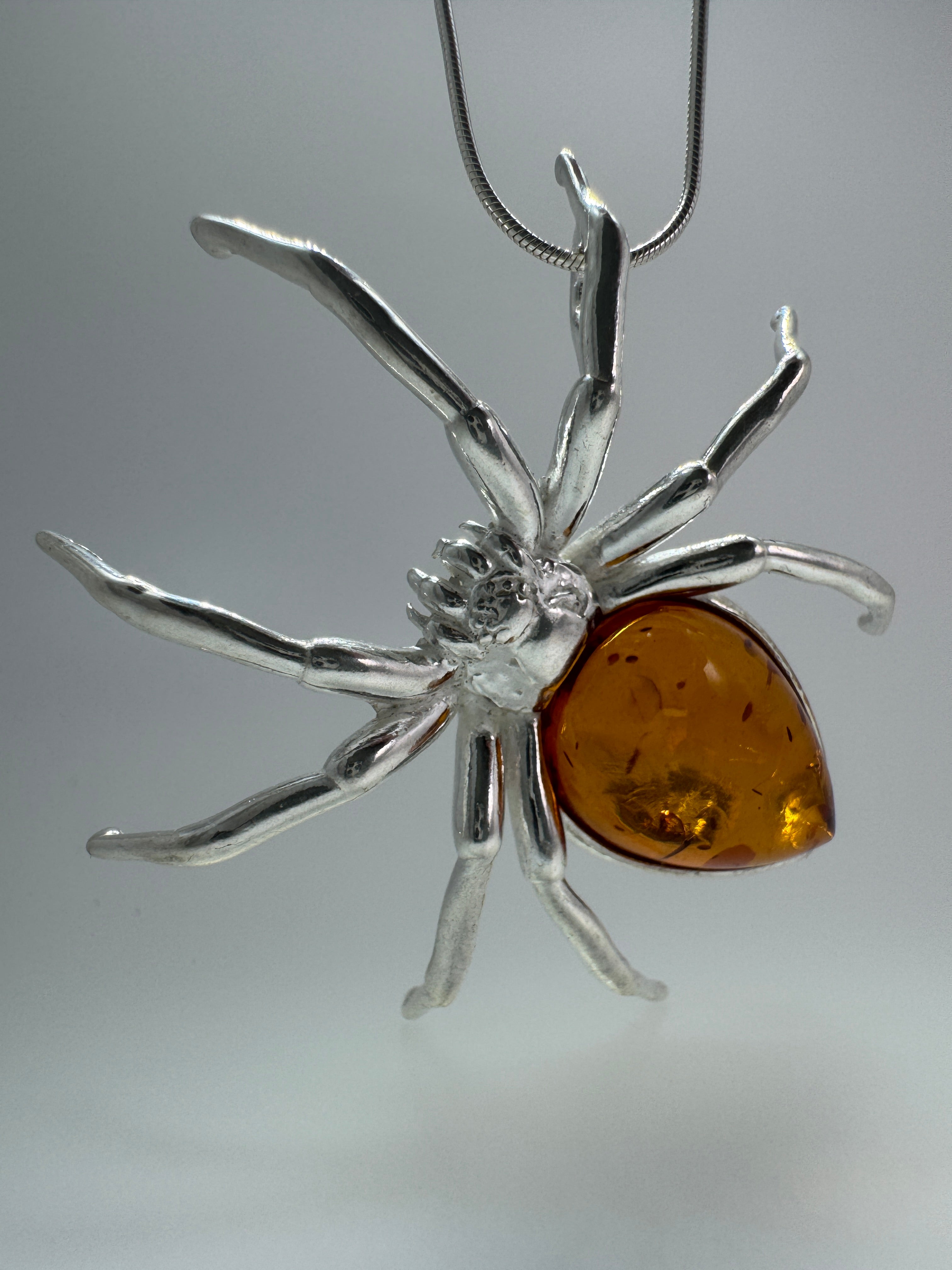 "Golden Glow Crawler" – Sterling Silver & Honey Baltic Amber Spider Pendant