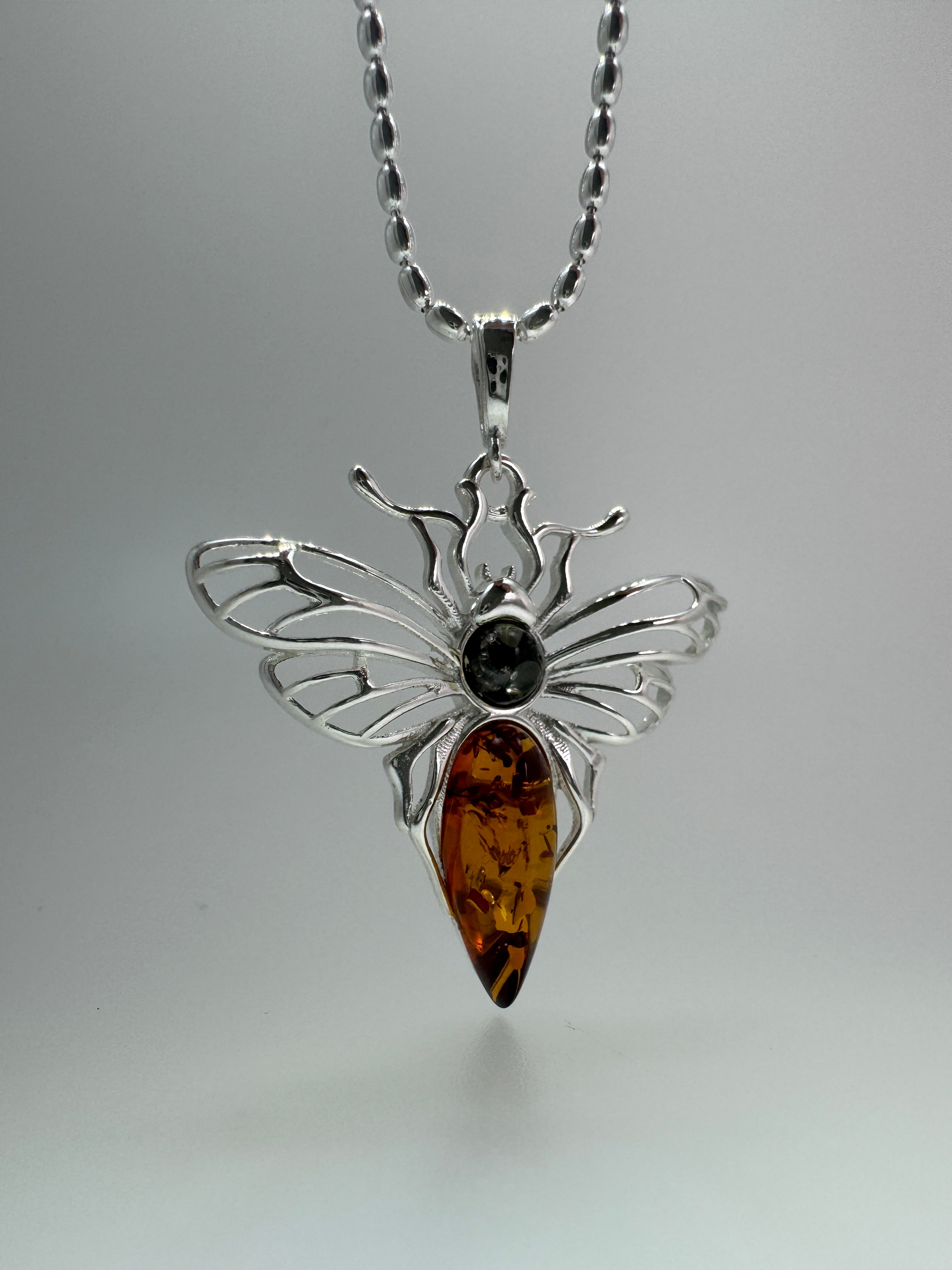 Mystic wings in amber – Sterling silver moth pendant with sterling silver chain