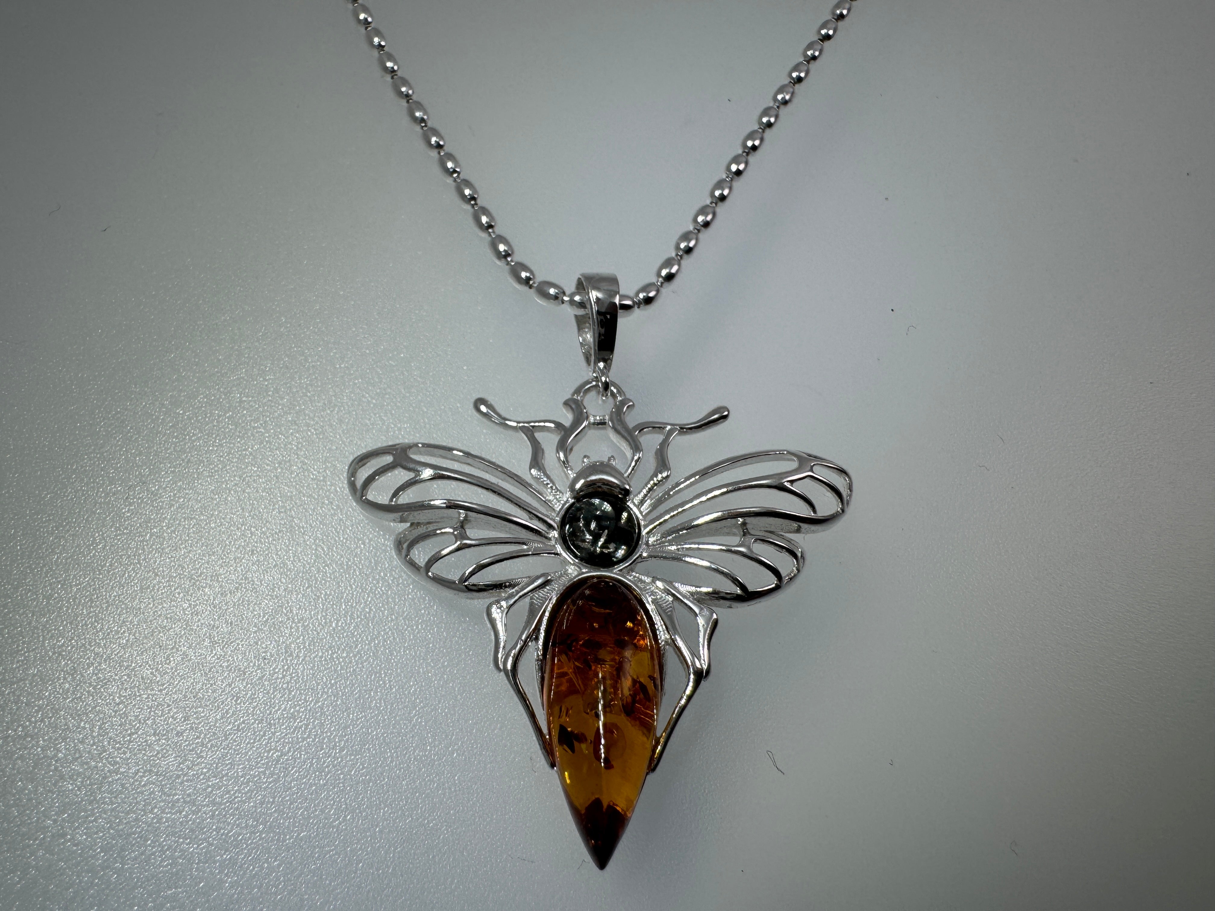 Mystic wings in amber – Sterling silver moth pendant with sterling silver chain