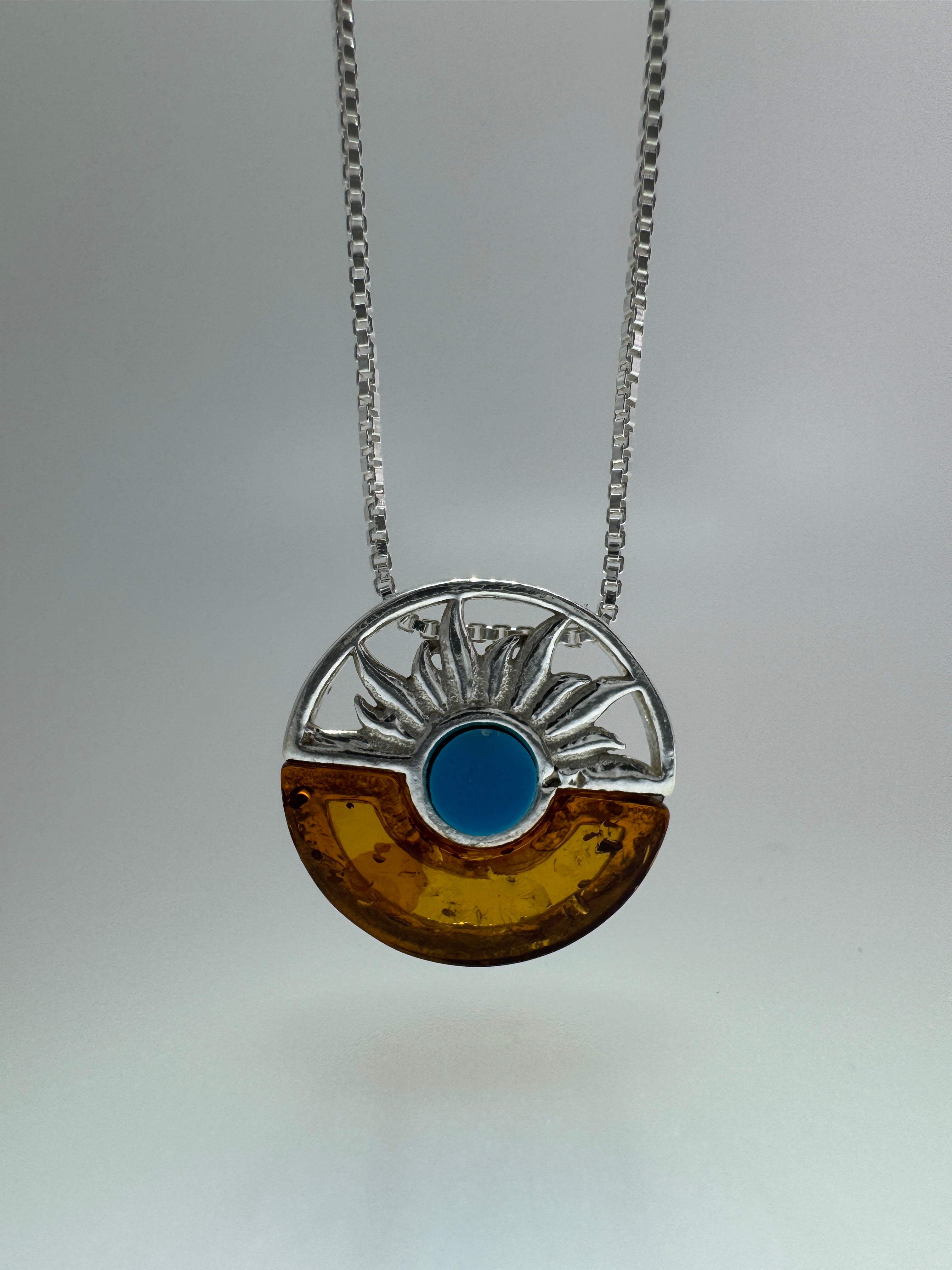 Baltic amber and turquoise pendant on silver chain - A timeless fusion of cultures and nature
