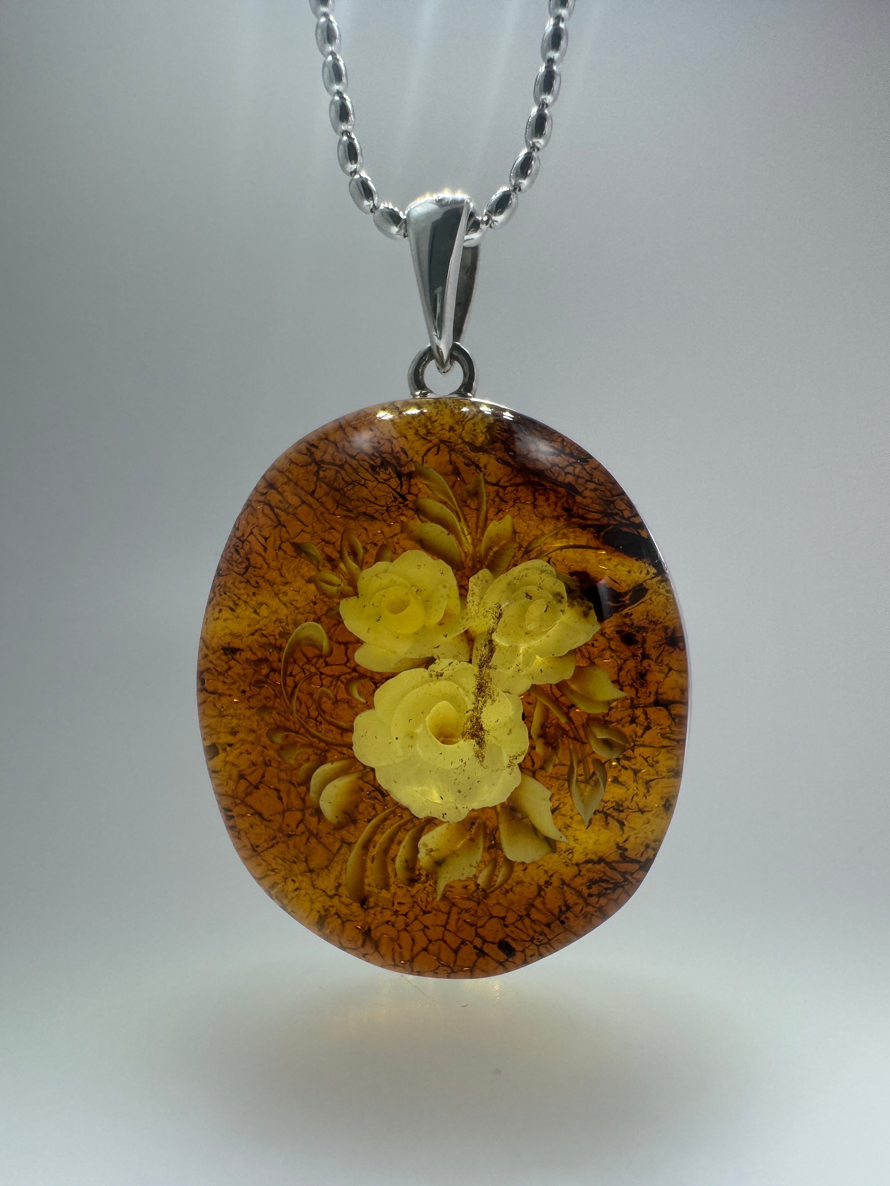 Timeless Elegance: Hand-Carved Baltic Amber Intaglio Flower Pendant