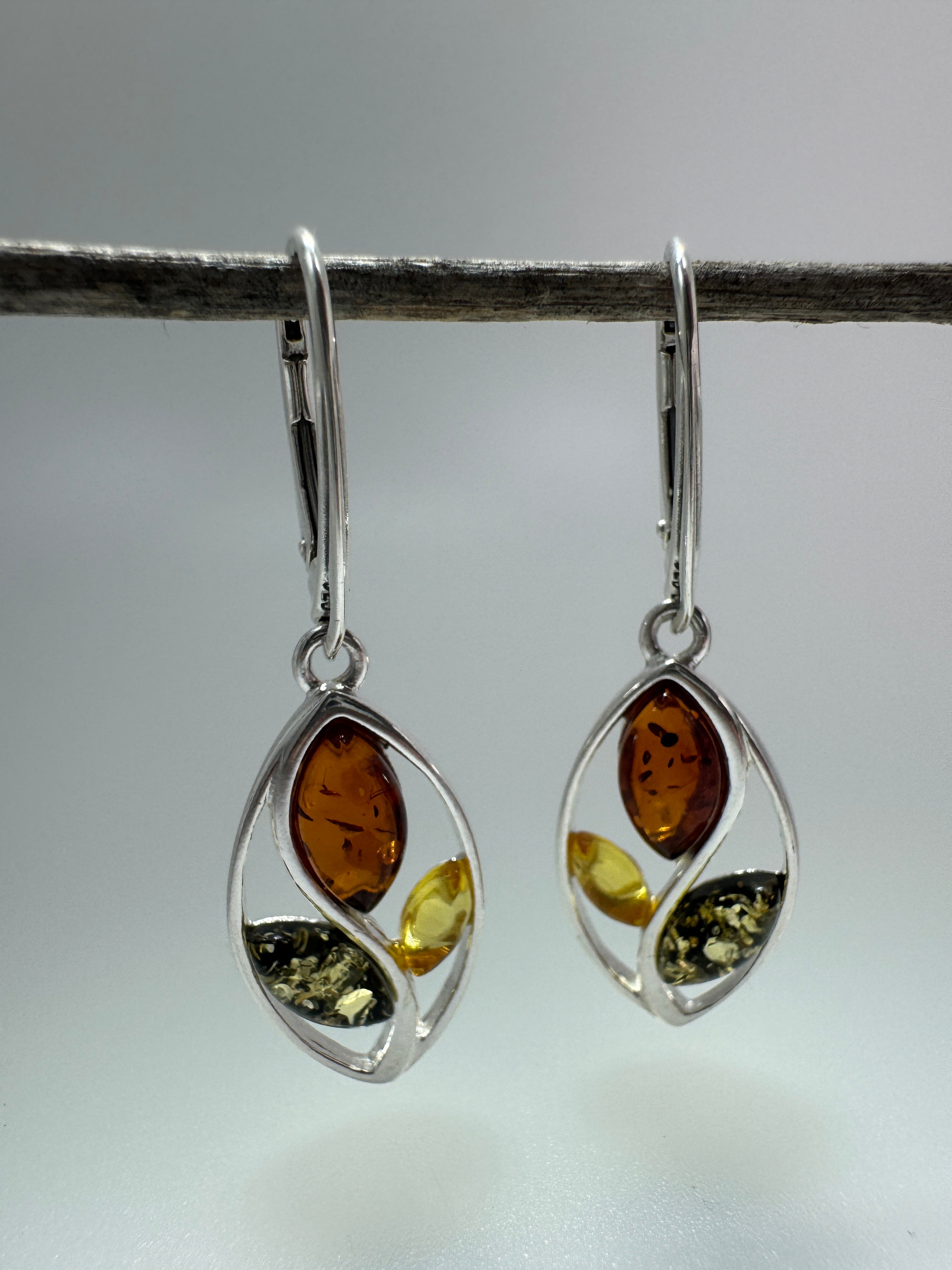 Swirl into Style: Multi-Color Baltic Amber Dangle Earrings in Sterling Silver