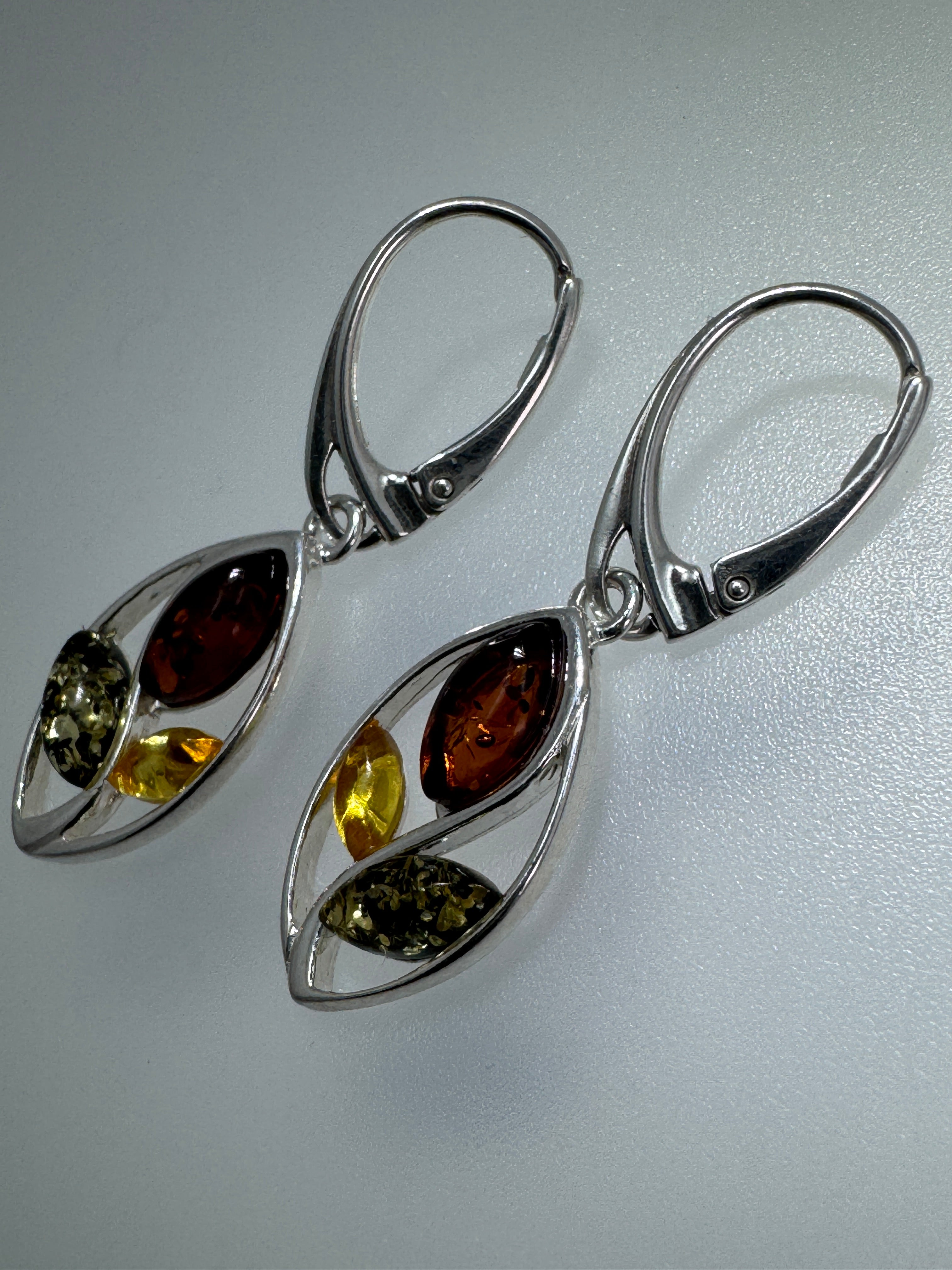 Swirl into Style: Multi-Color Baltic Amber Dangle Earrings in Sterling Silver