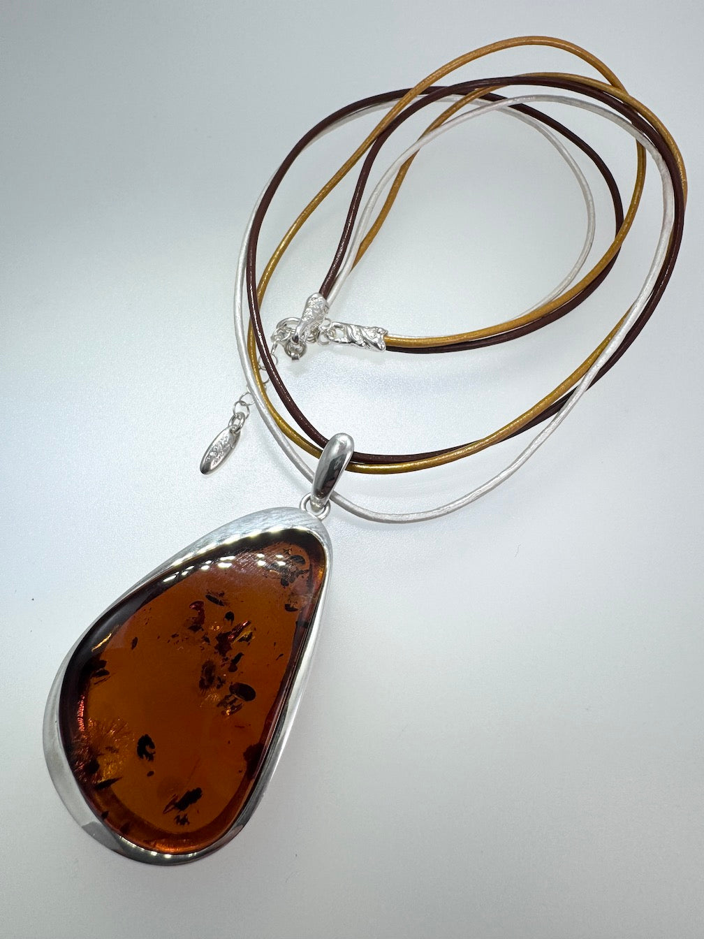Modern Sterling Silver & Cognac Baltic Amber Pendant Necklace on Multicolor Leather Cord – Handmade in Poland