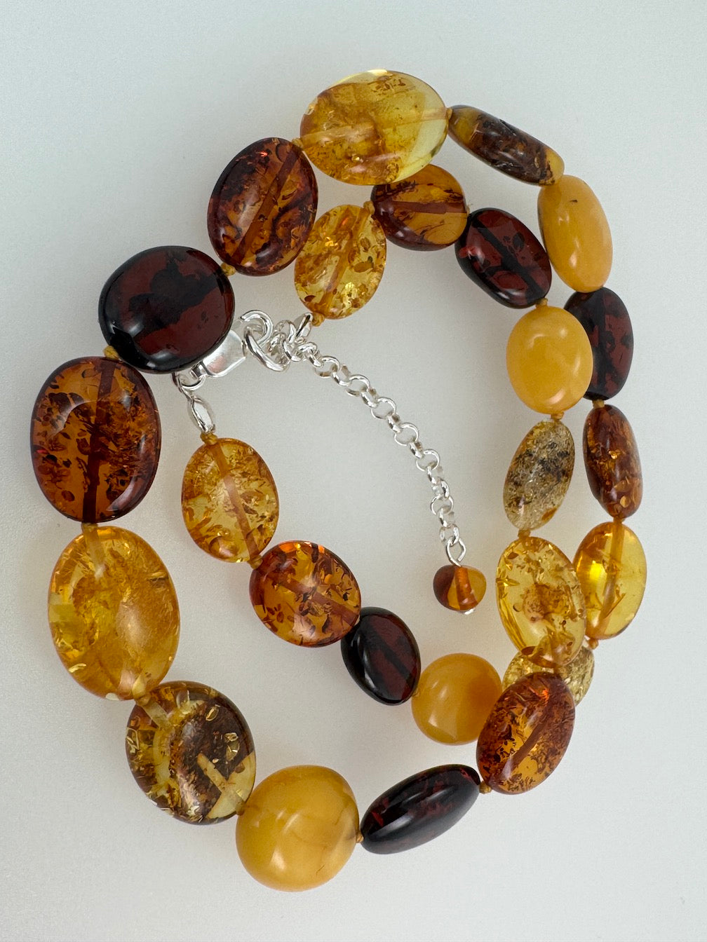 Multicolor Baltic Amber Bead Necklace – Oval Bean Shape, Sterling Silver Closure, Handmade in Lithuania