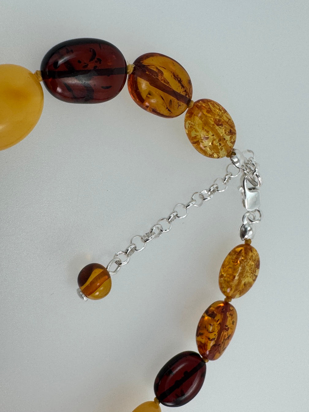 Multicolor Baltic Amber Bead Necklace – Oval Bean Shape, Sterling Silver Closure, Handmade in Lithuania