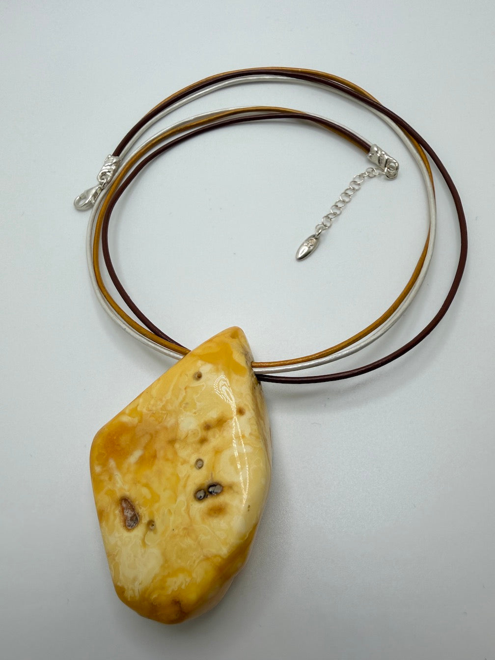 One of a kind Butterscotch Amber necklace on multi leather with silver clasp