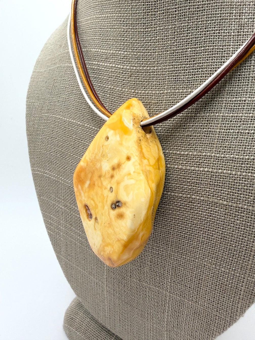 One of a kind Butterscotch Amber necklace on multi leather with silver clasp