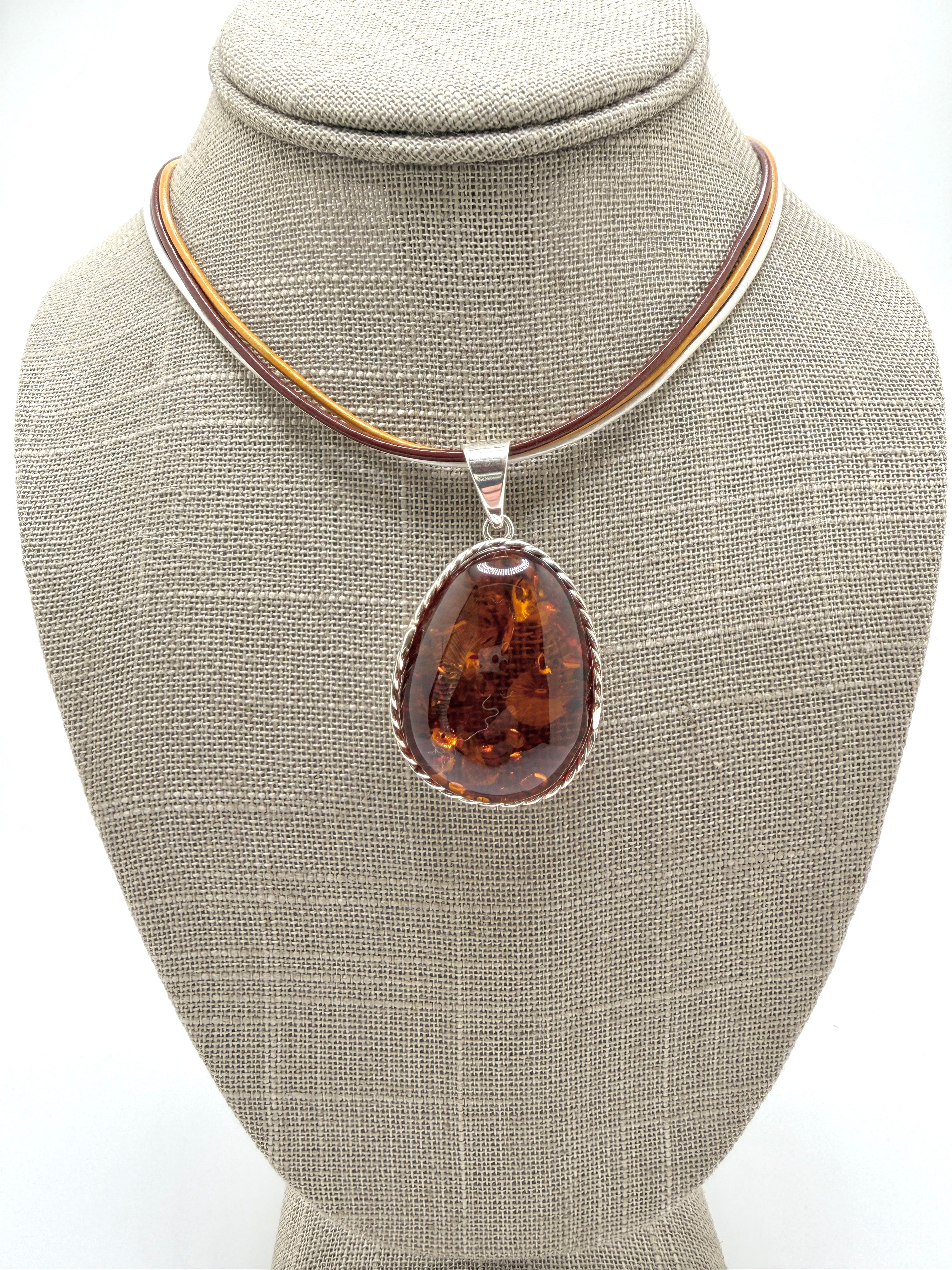 Oversized Honey Cognac Baltic Amber Pendant on Thick Brown, Gold and White Leather Cord – Handmade in Poland – Sterling Silver Setting