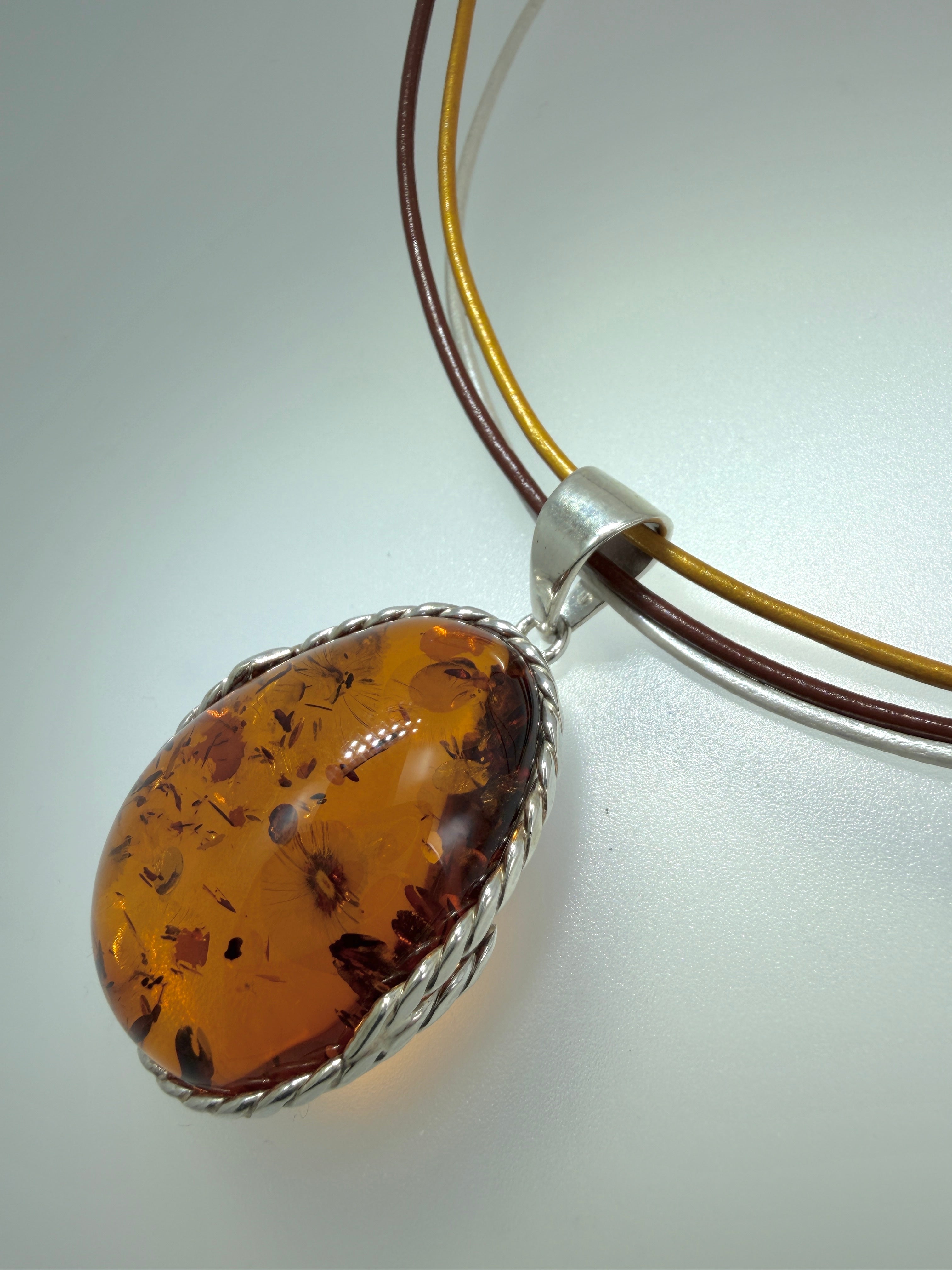 Oversized Honey Cognac Baltic Amber Pendant on Thick Brown, Gold and White Leather Cord – Handmade in Poland – Sterling Silver Setting