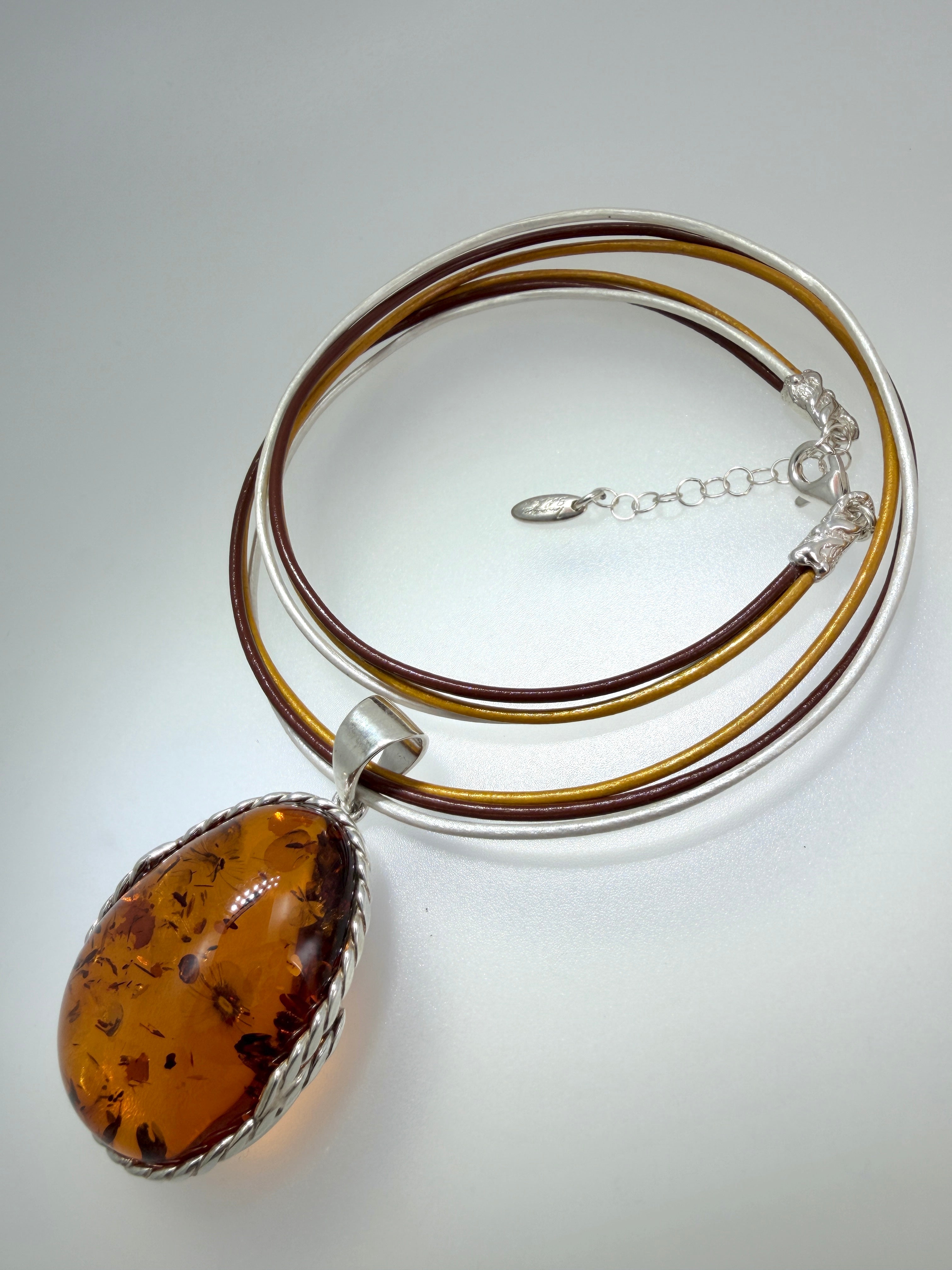 Oversized Honey Cognac Baltic Amber Pendant on Thick Brown, Gold and White Leather Cord – Handmade in Poland – Sterling Silver Setting