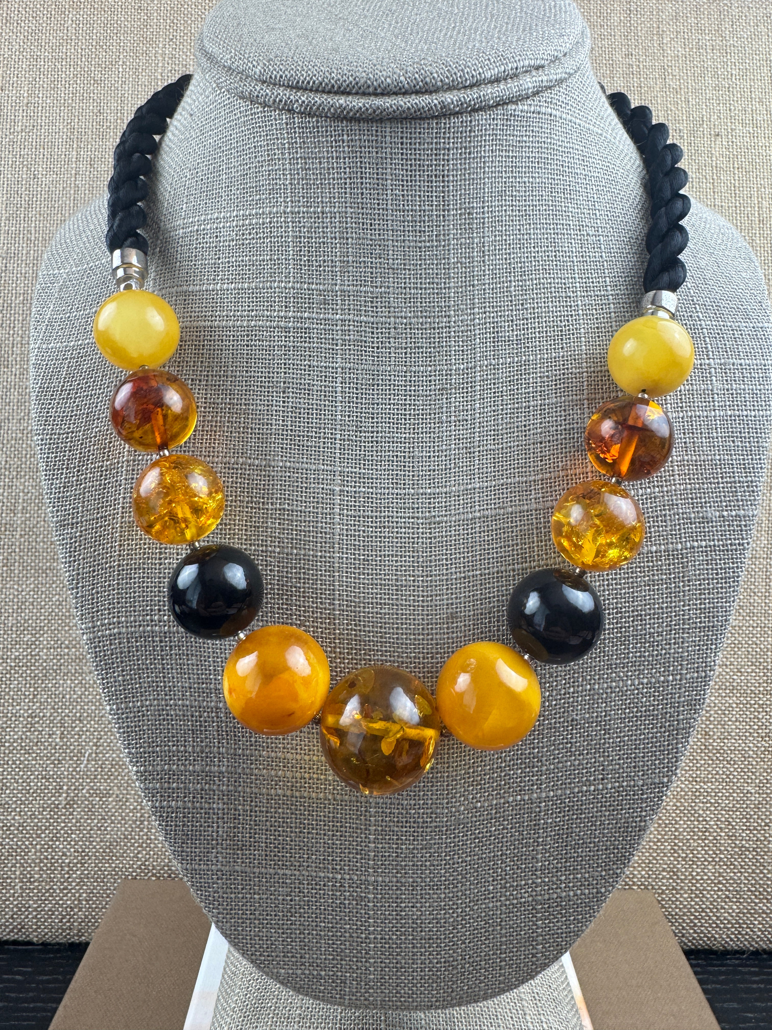 Oversized Round Baltic Amber Ball Necklace – Multicolor Graduated Design on Twisted Cord