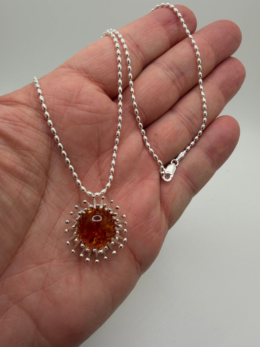 Sterling Silver Cognac Baltic Amber Pendant Necklace – Modern Whimsical Design on Bead Chain – Unique Silver Pin Setting