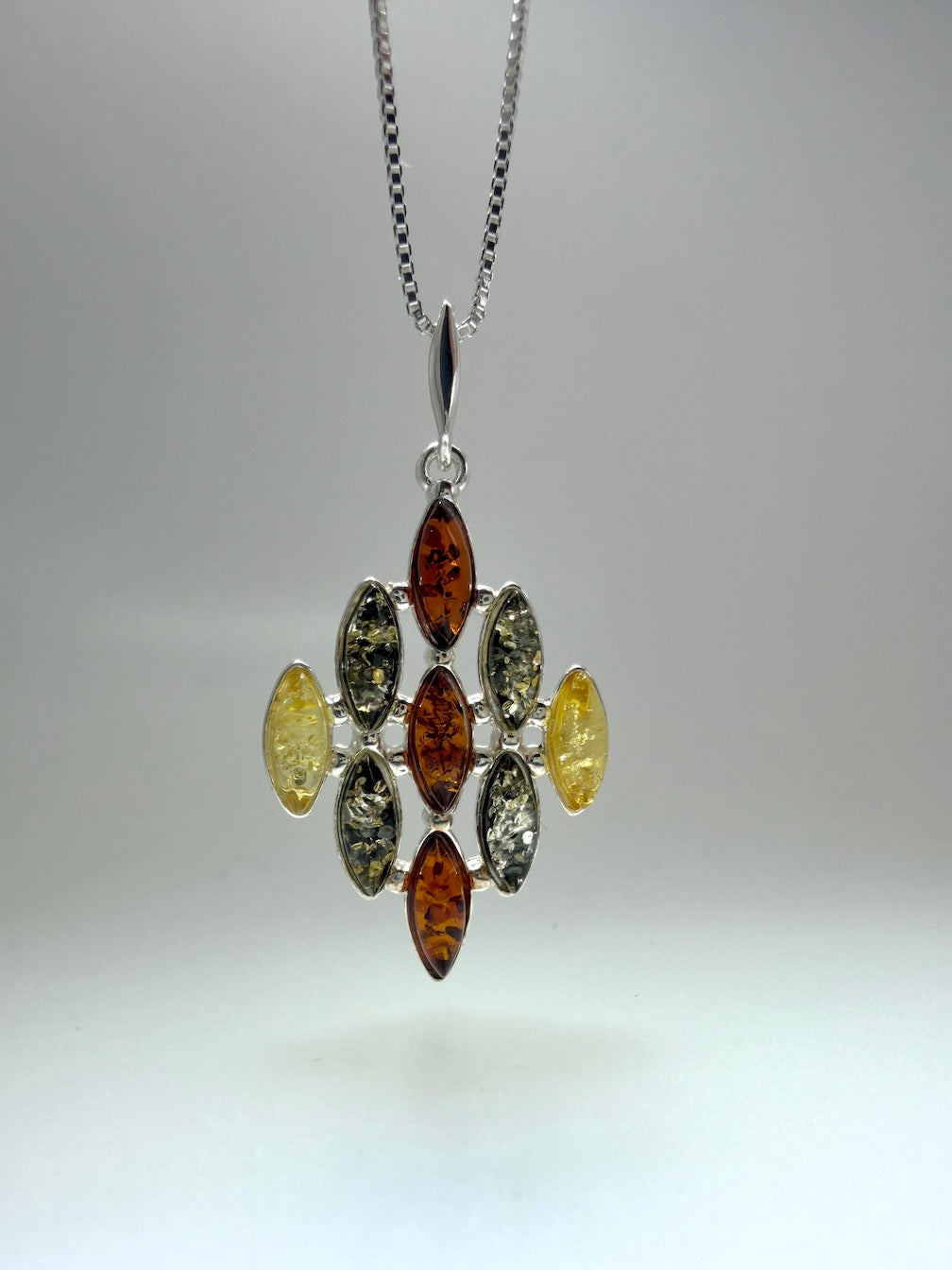 SEO Title:
Sterling Silver Multistone Baltic Amber Drop Pendant – Handmade in Poland – Marquise Amber Necklace