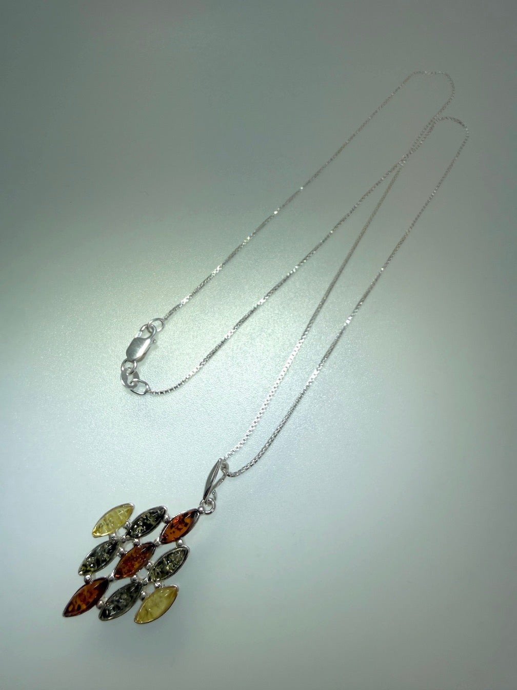 SEO Title:
Sterling Silver Multistone Baltic Amber Drop Pendant – Handmade in Poland – Marquise Amber Necklace