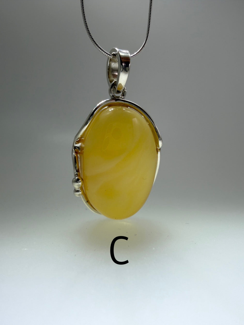 Sterling Silver Organic Pendant with Rare Butterscotch Baltic Amber – Modern Statement Necklace