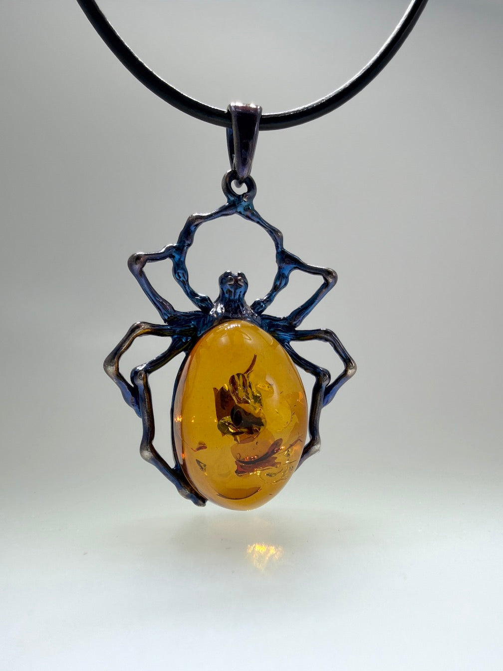 Unique Copper Blue Oxidized Sterling Silver Spider Pendant with Genuine Cognac Baltic Amber Stone on Black Leather Wire