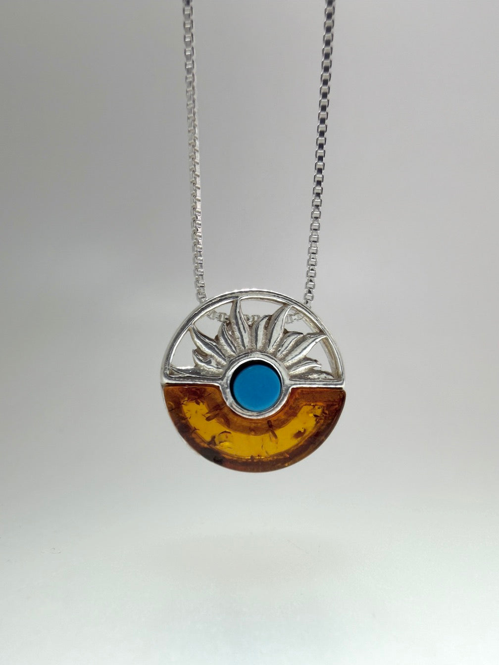 A Timeless Fusion of Cultures and Nature - Baltic amber and Turquoise Pendant on silver chain